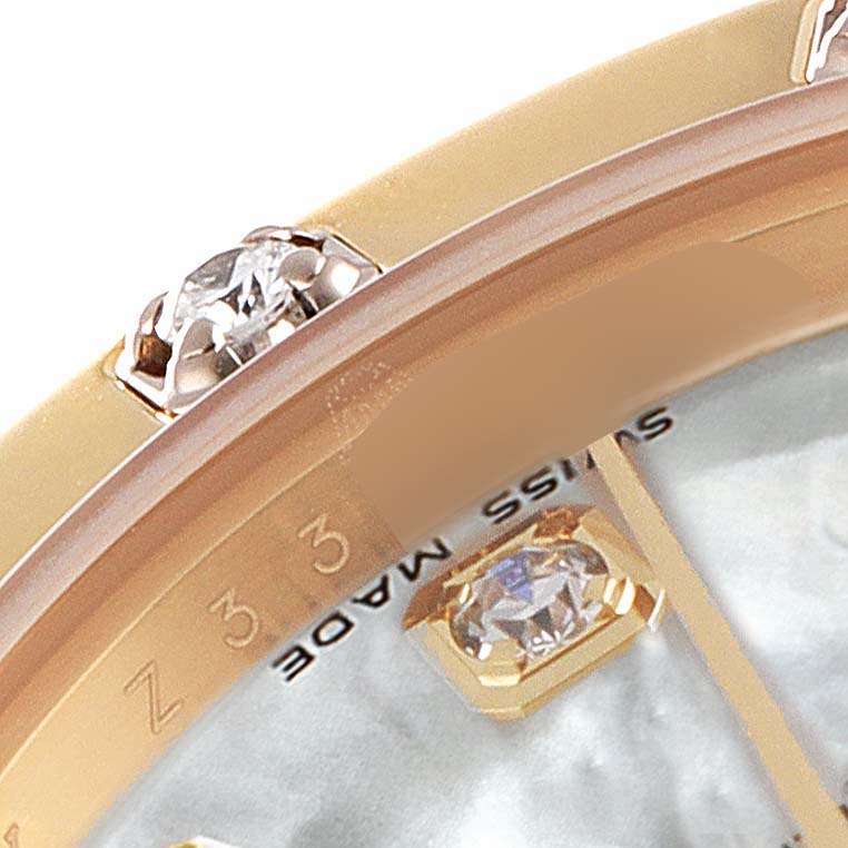 The image shows a close-up of a Rolex Pearlmaster 80318 Women's Yellow Gold Mother of Pearl Dial 80318 Women's Yellow Gold Mother of Pearl Dial watch's bezel with diamonds and part of the watch face.