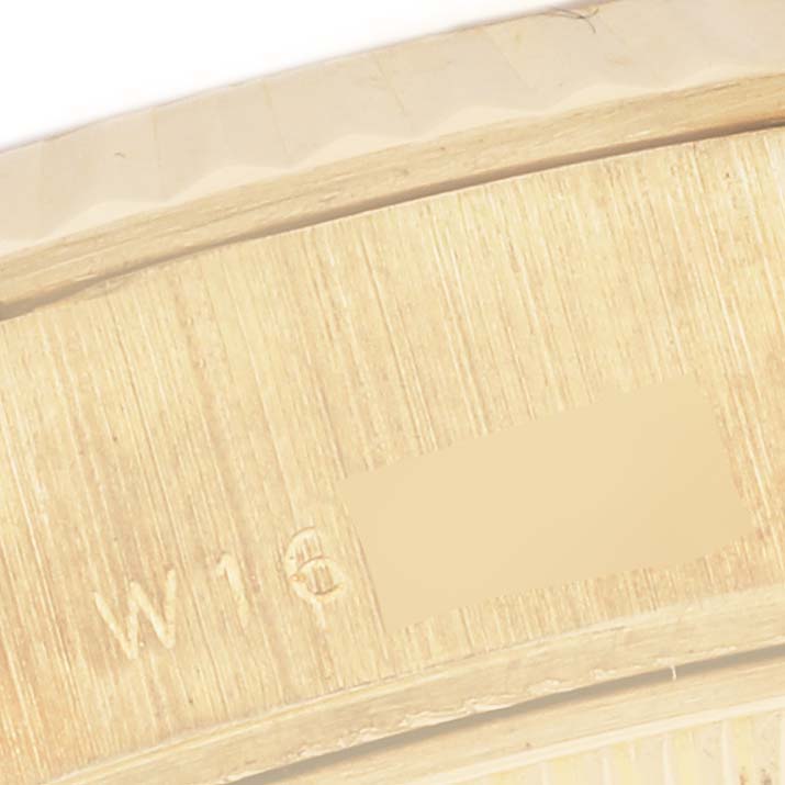The image shows a close-up of the inner part of the Rolex President 69178 Women's Yellow Gold Champagne Dial 69178 Women's Yellow Gold Champagne Dial's case with engravings visible.