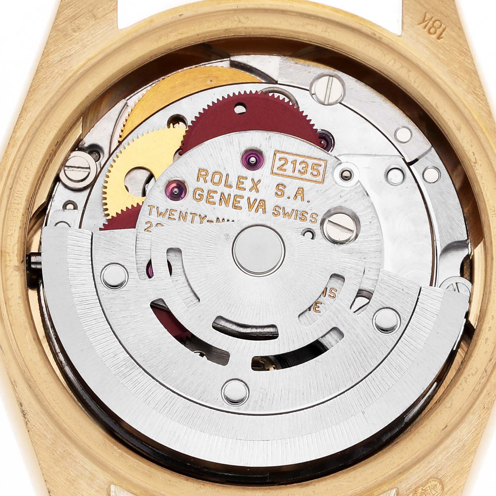 The image shows the movement of a Rolex President 69178 Women's Yellow Gold Champagne Dial 69178 Women's Yellow Gold Champagne Dial model, displaying gears and the rotor from the back.