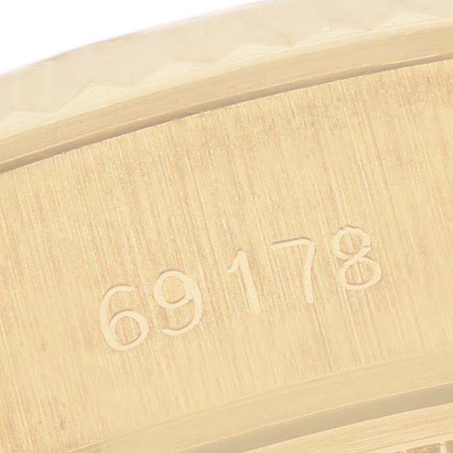 The image shows a close-up of the Rolex President 69178 Women's Yellow Gold Champagne Dial 69178 Women's Yellow Gold Champagne Dial model's case, highlighting the engraved model number "69178."