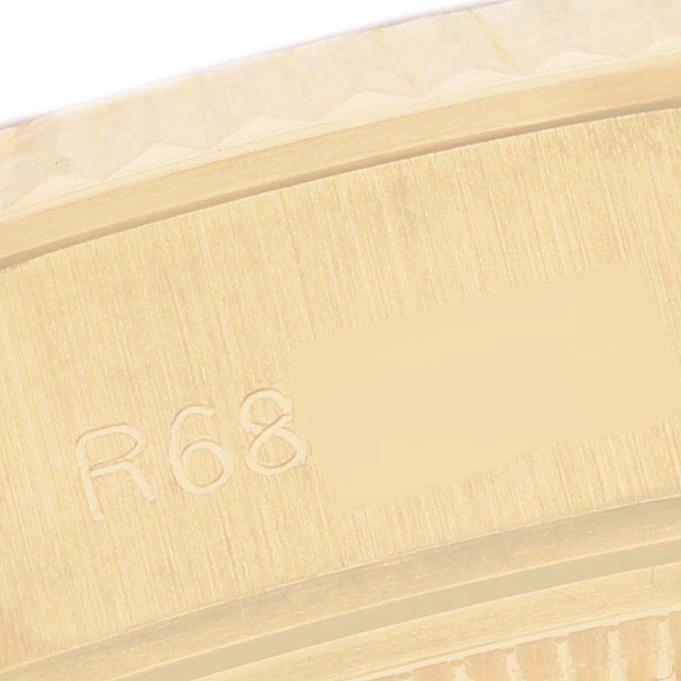The image shows a close-up of the side engraving on the Rolex President 69178 Women's Yellow Gold Champagne Dial 69178 Women's Yellow Gold Champagne Dial model's case.
