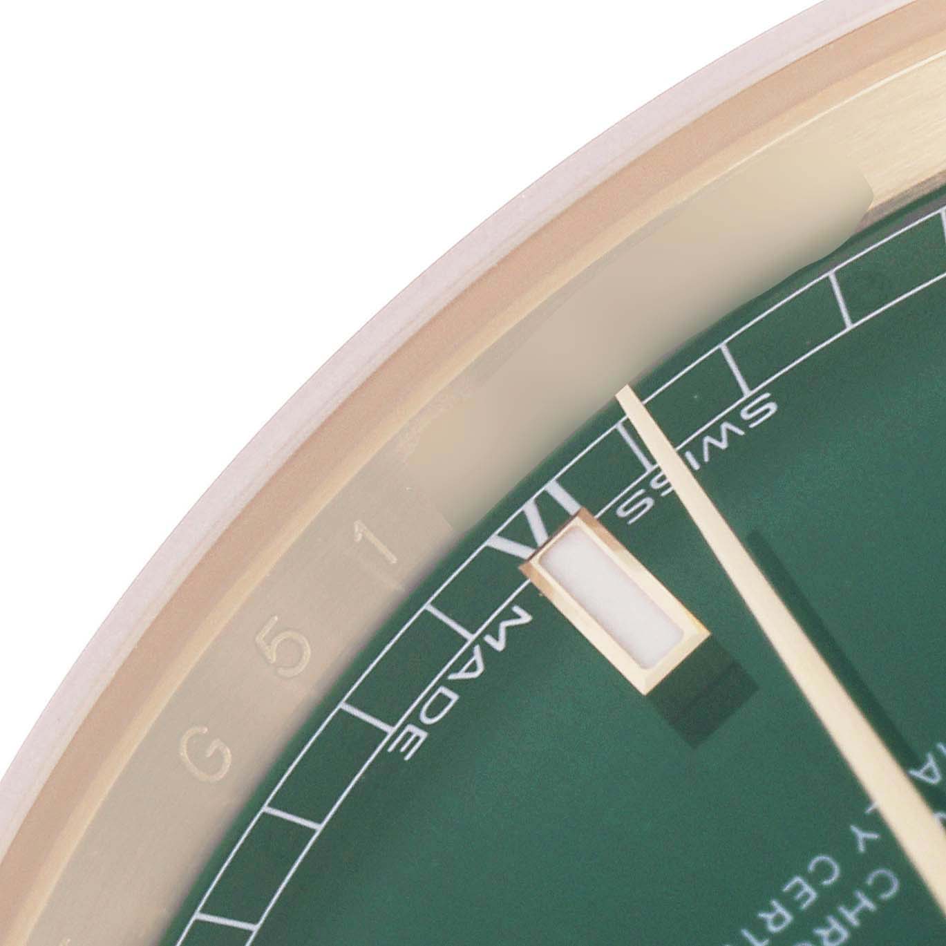 The image shows a close-up of the dial and markers of a Rolex President 118238 Men
s Yellow Gold Green Dial 118238 Men
s Yellow Gold Green Dial watch, focusing on the edge and minute markers.