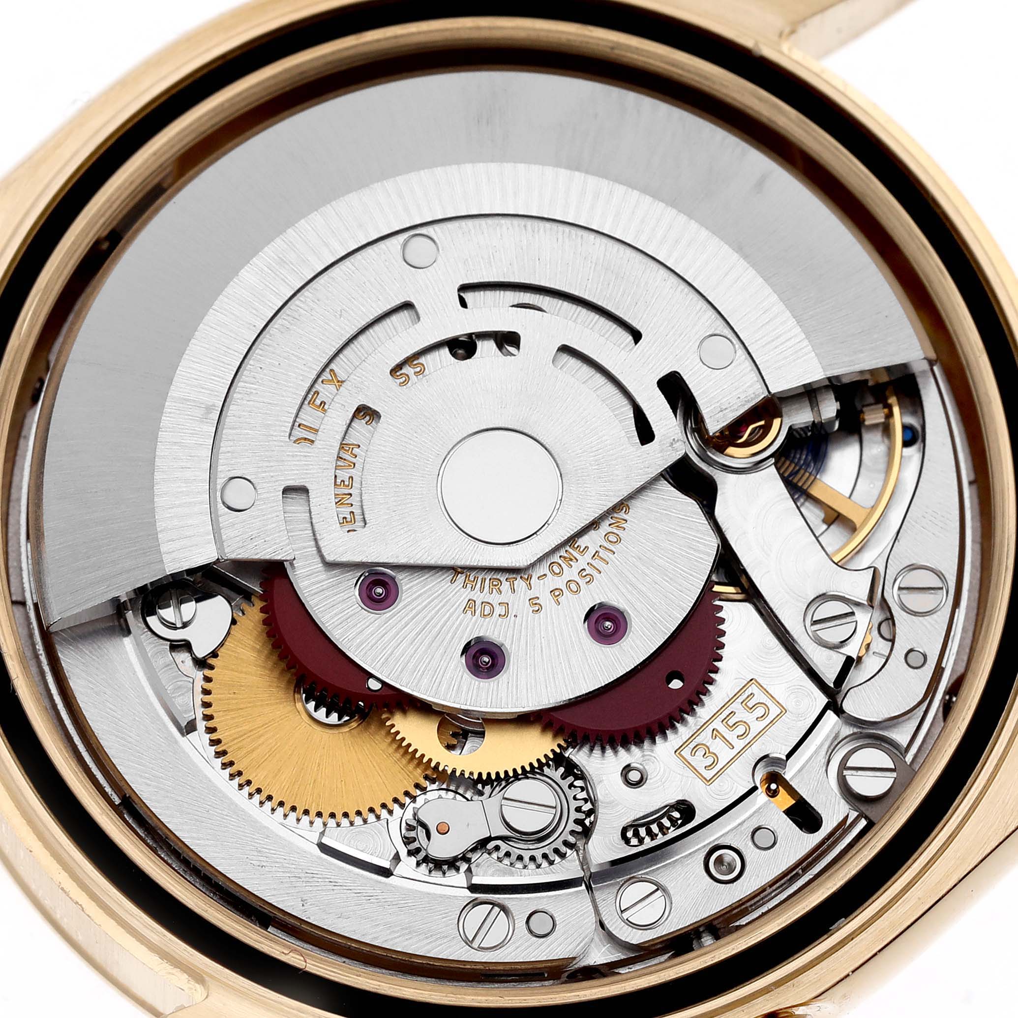 The image shows the internal movement of a Rolex President 118238 Men
s Yellow Gold Green Dial 118238 Men
s Yellow Gold Green Dial watch from a close-up top view, detailing gears and components.