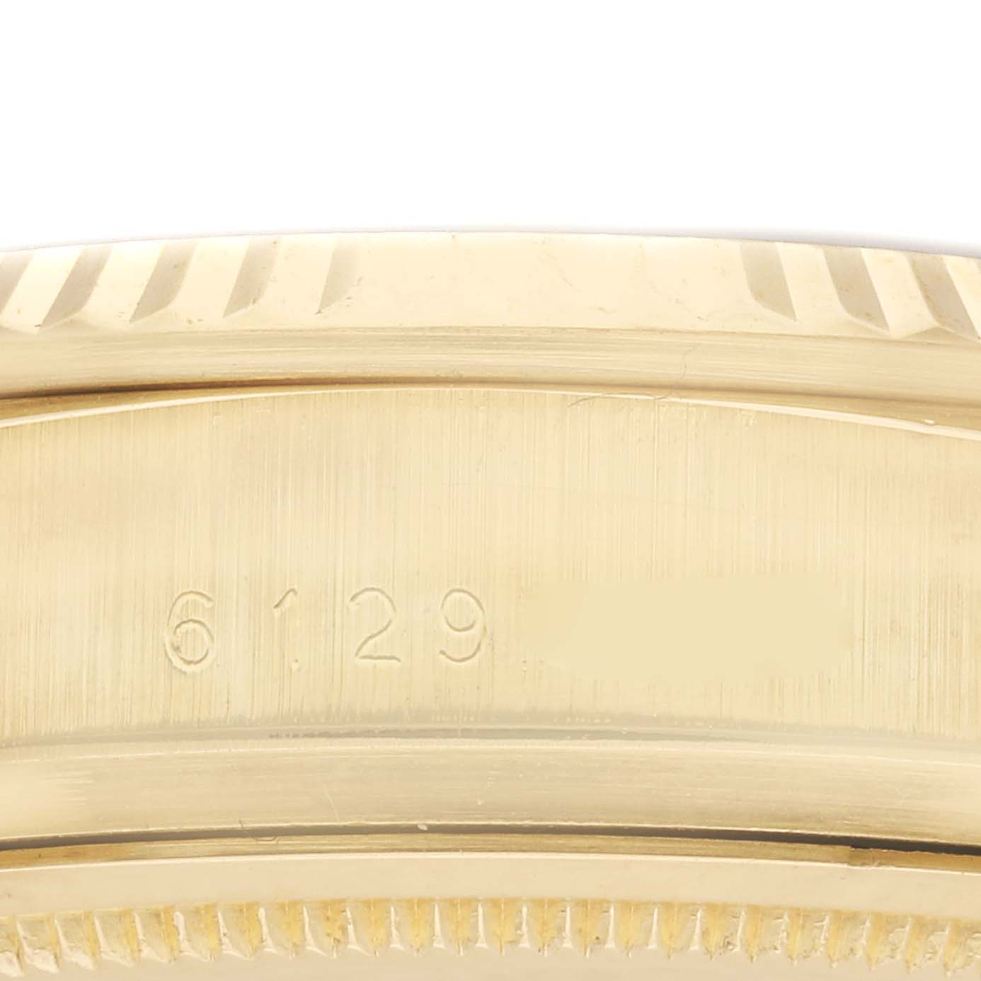 This image shows a close-up of the side of a Rolex President 18038 Men's Yellow Gold Blue Dial 18038 Men's Yellow Gold Blue Dial watch, highlighting the model number engraving.