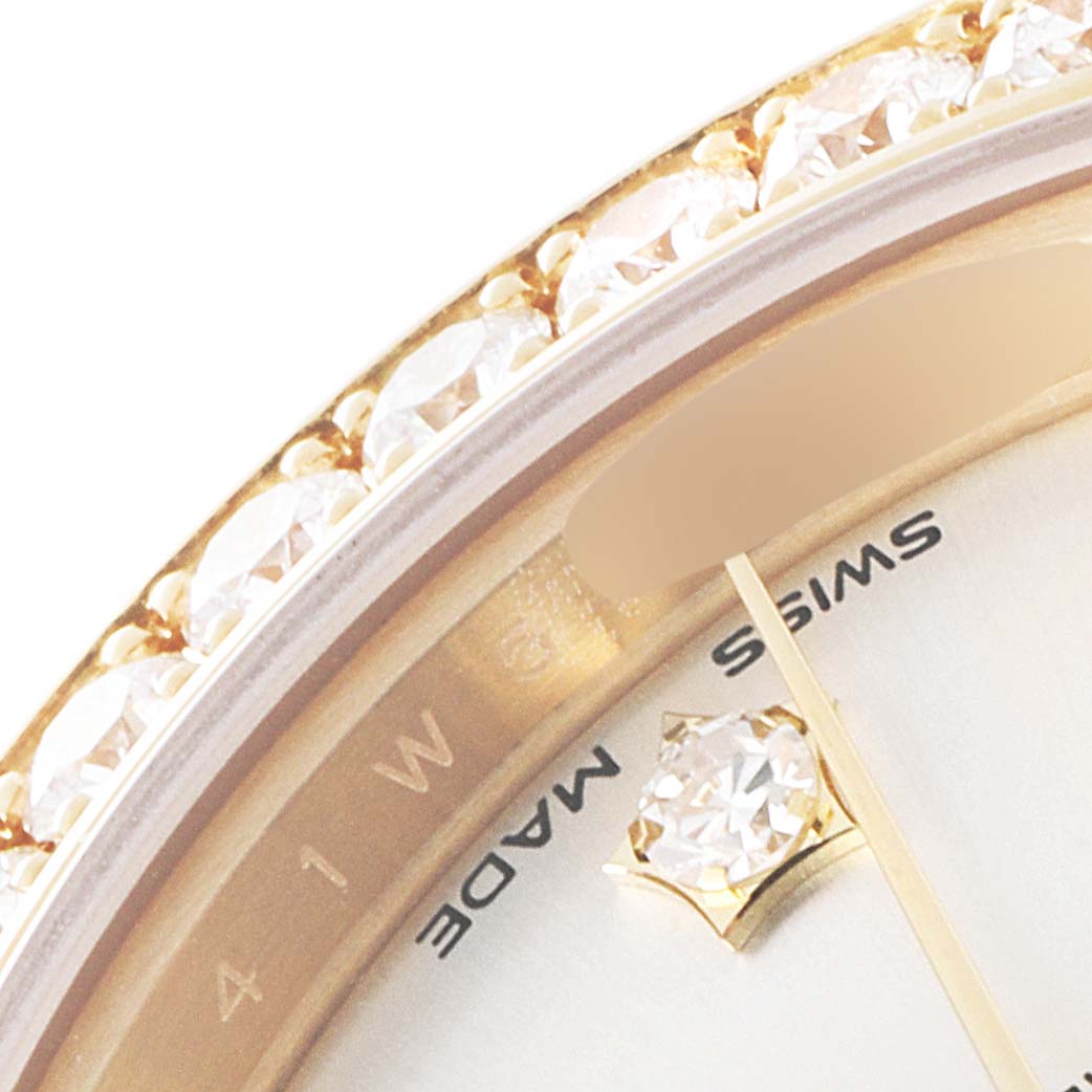 The image shows a close-up of the bezel with diamonds and part of the dial of the Rolex President 279138 Women's Yellow Gold Silver Dial 279138 Women's Yellow Gold Silver Dial model watch.