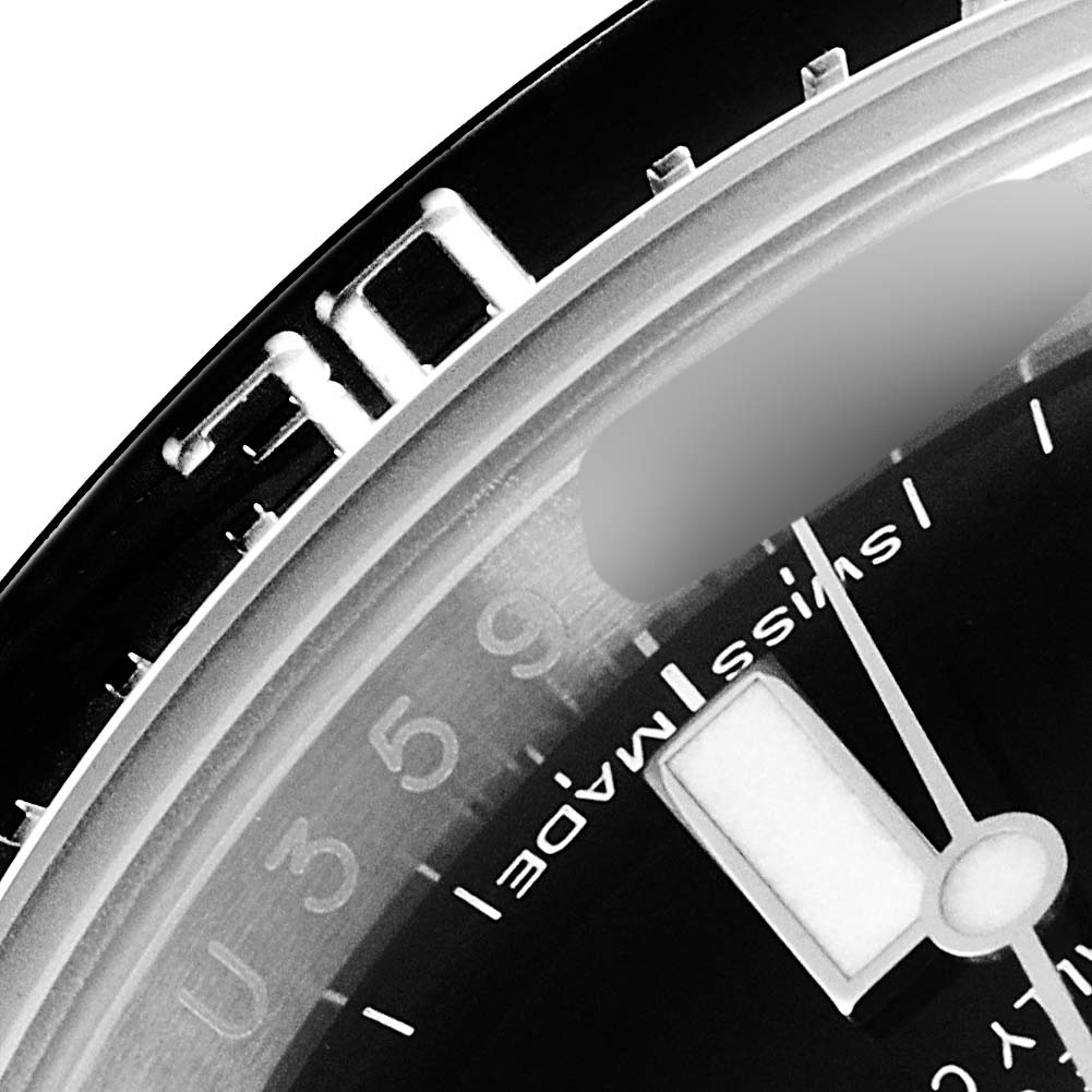 This is a close-up view of the bezel, minute markers, and part of the dial and hands of a Rolex Sea-Dweller 116600 Men
s Stainless Steel Black Dial 116600 Men
s Stainless Steel Black Dial watch.