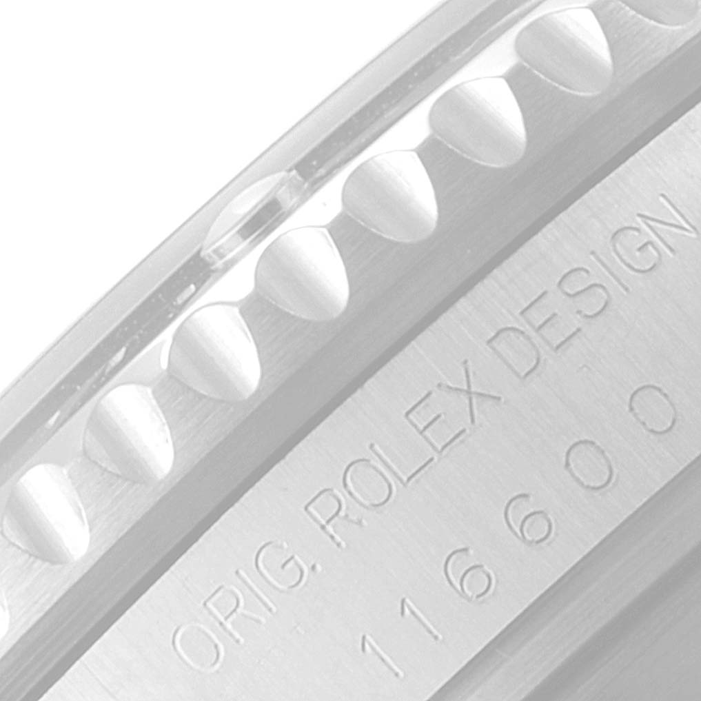The image shows a close-up of the engraved side of the bezel of a Rolex Sea-Dweller 116600 Men
s Stainless Steel Black Dial 116600 Men
s Stainless Steel Black Dial watch.