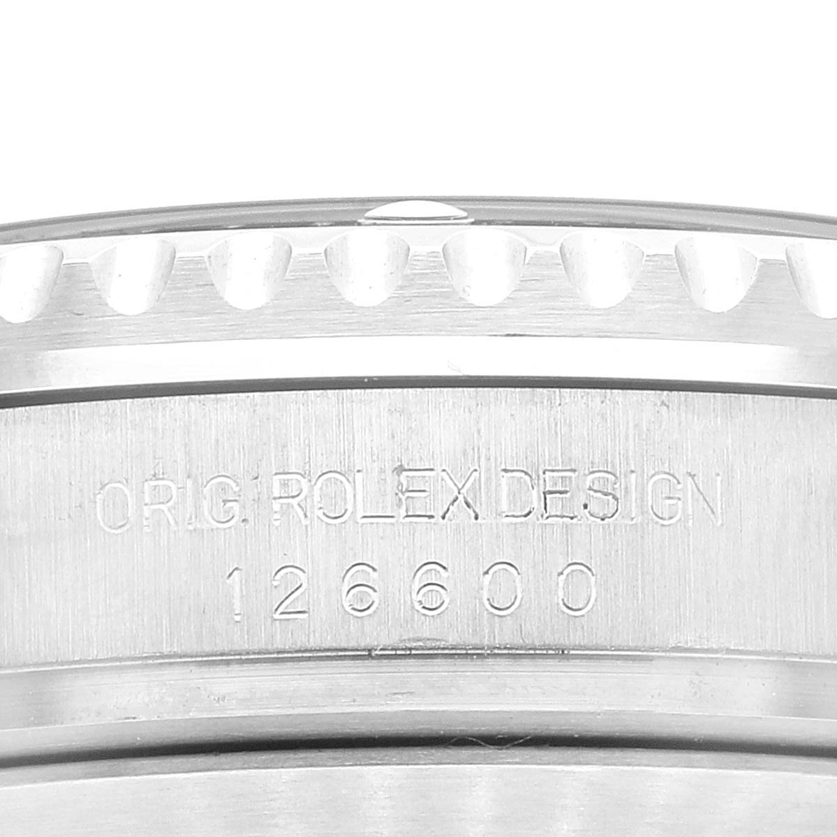 This image shows a close-up of the engraving on the side of the bezel and case of a Rolex Sea-Dweller 126600 Men
s Stainless Steel Black Dial 126600 Men
s Stainless Steel Black Dial model, highlighting "ORIG ROLEX DESIGN 126600."
