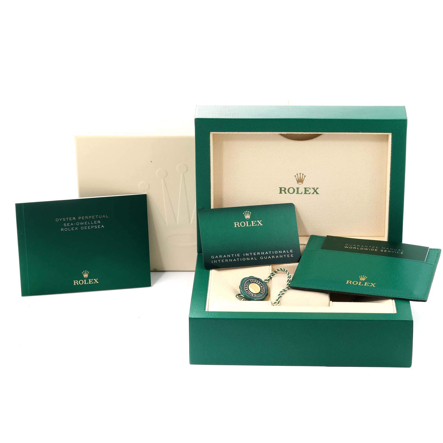 The image shows the packaging and accessories for a Rolex Sea-Dweller 126600 Men
s Stainless Steel Black Dial 126600 Men
s Stainless Steel Black Dial, including a box, booklets, and a tag.