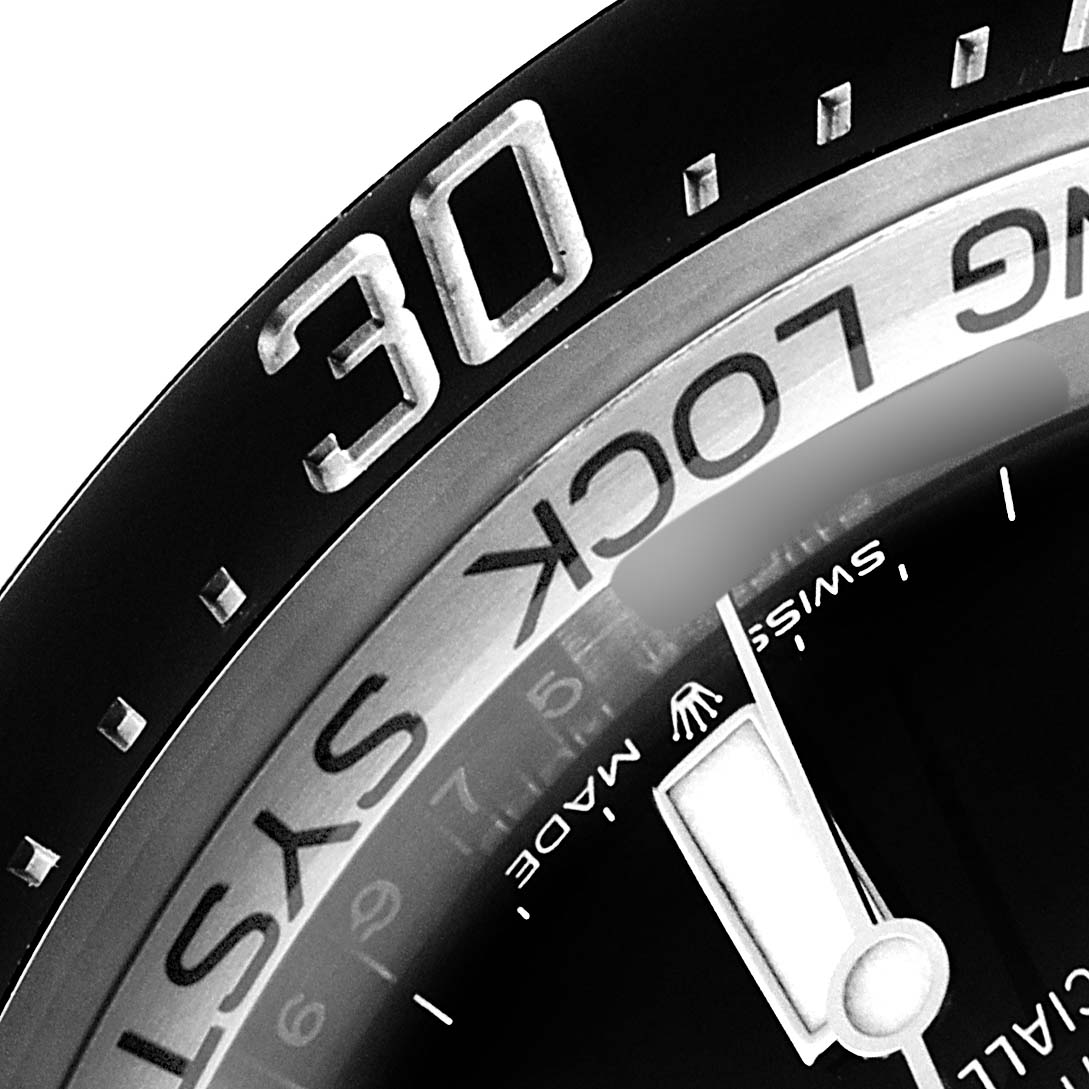 This is a close-up of the bezel and part of the dial of a Rolex Sea-Dweller 126660 Men
s Stainless Steel Black Dial 126660 Men
s Stainless Steel Black Dial watch, showing the "30" minute mark and part of the "RING LOCK SYSTEM" text.