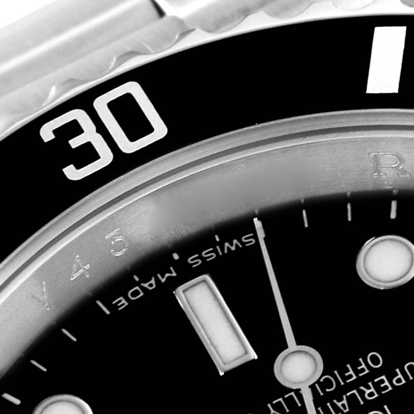 The image shows a close-up of the dial and bezel, specifically the "30" minute marker, of a Rolex Submariner 16610 Men
s Stainless Steel Black Dial 16610 Men
s Stainless Steel Black Dial watch.