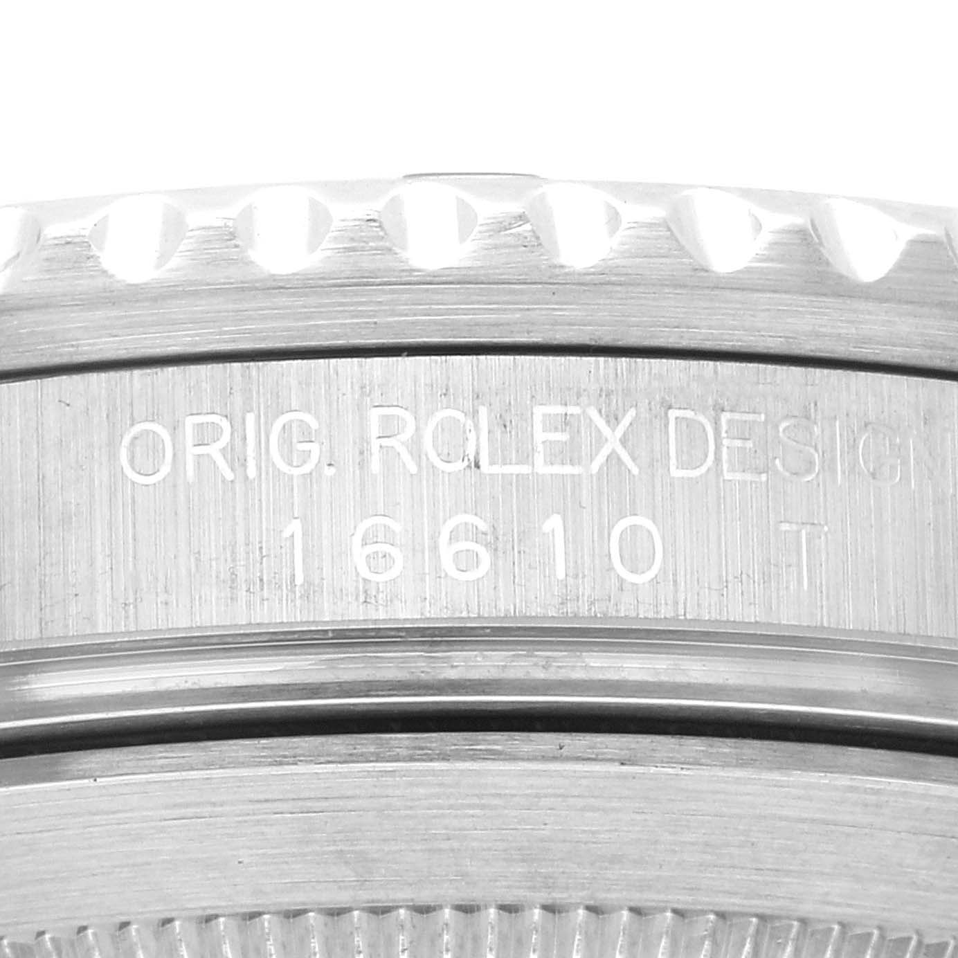 This image shows an angled close-up of the side engraving and bezel teeth of a Rolex Submariner 16610 Men
s Stainless Steel Black Dial 16610 Men
s Stainless Steel Black Dial model 16610.