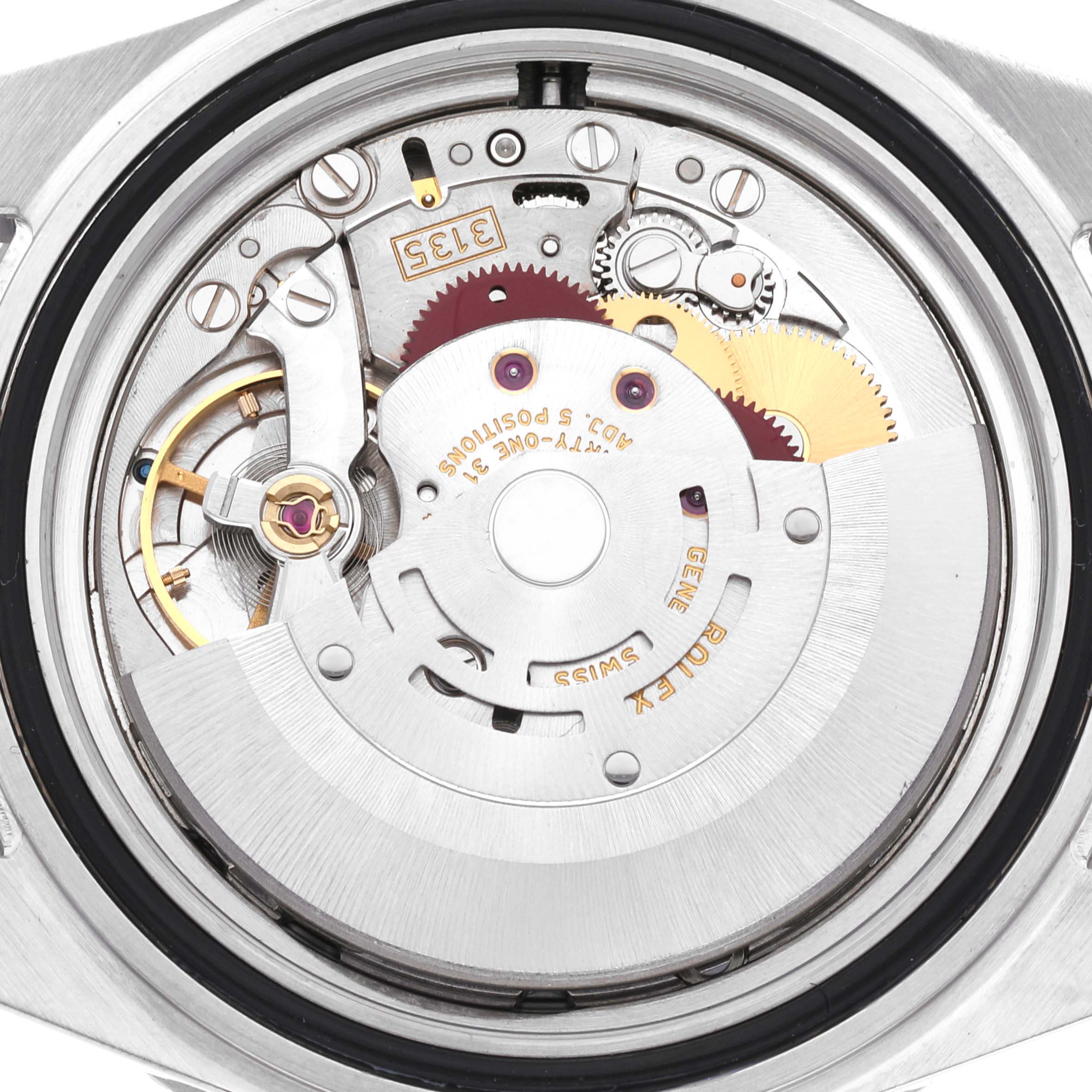 This image shows the inner mechanism and movement of a Rolex Submariner 16610 Men
s Stainless Steel Black Dial 16610 Men
s Stainless Steel Black Dial watch viewed from the back.