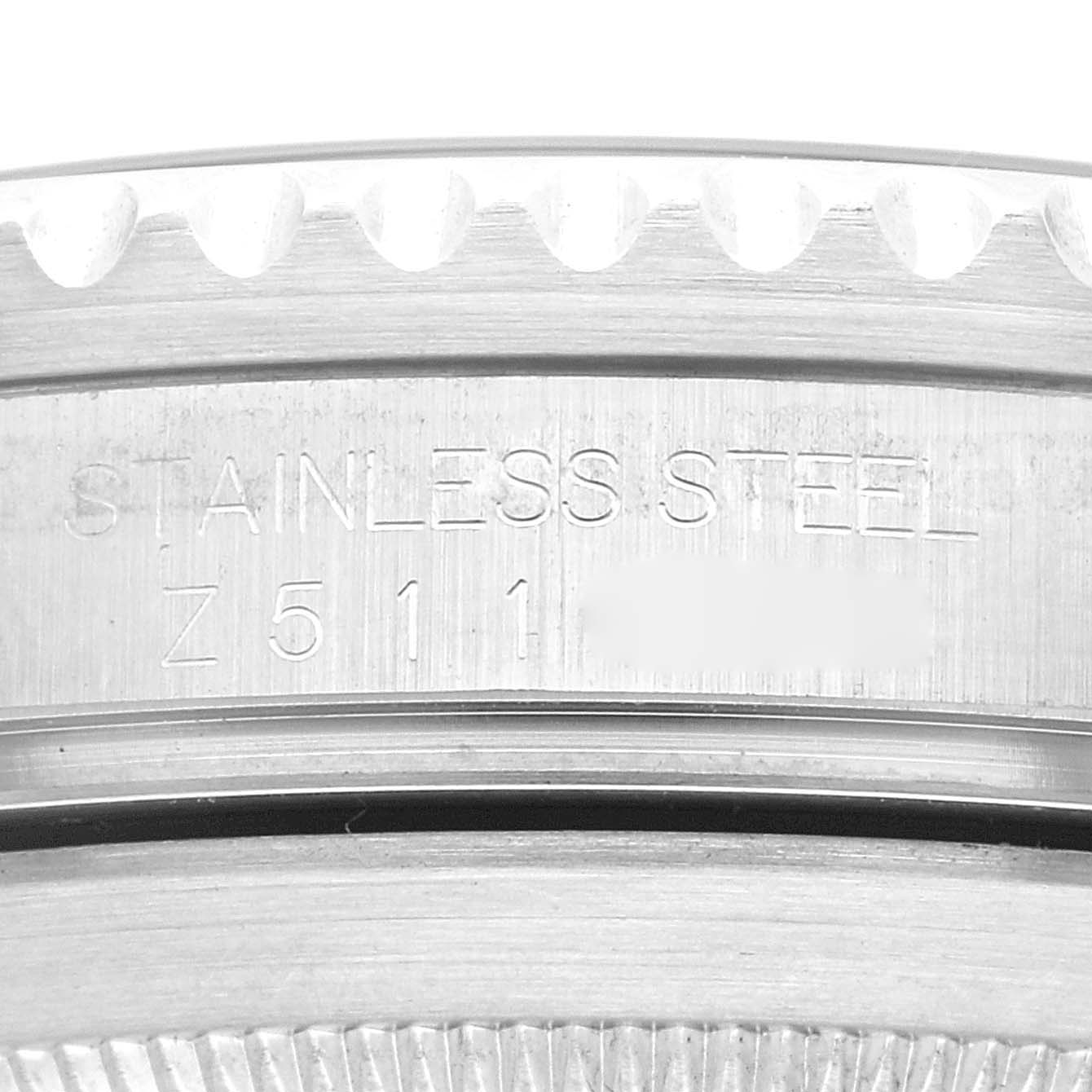 This image shows a close-up of the case back with serial number engraving on a Rolex Submariner 16610 Men
s Stainless Steel Black Dial 16610 Men
s Stainless Steel Black Dial watch.