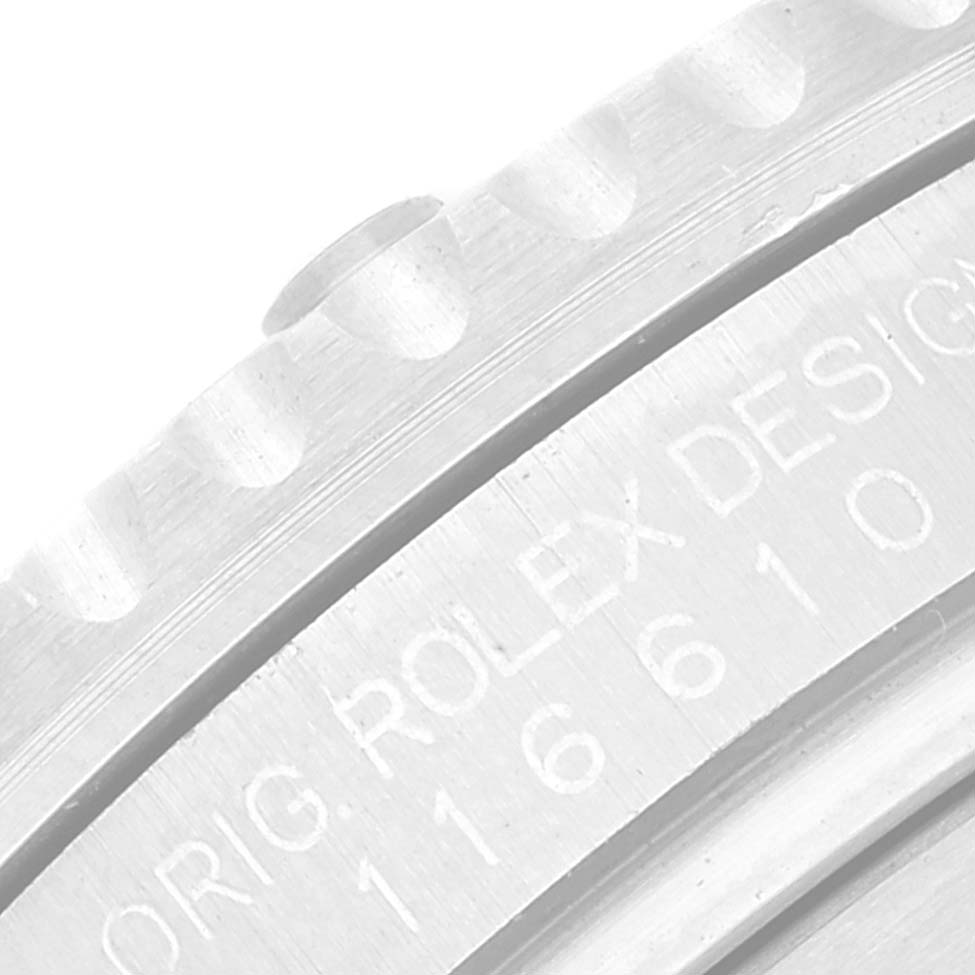 The image shows a close-up of the bezel and engraved case side of a Rolex Submariner 116610LV Men
s Stainless Steel Green Dial 116610LV Men
s Stainless Steel Green Dial watch.