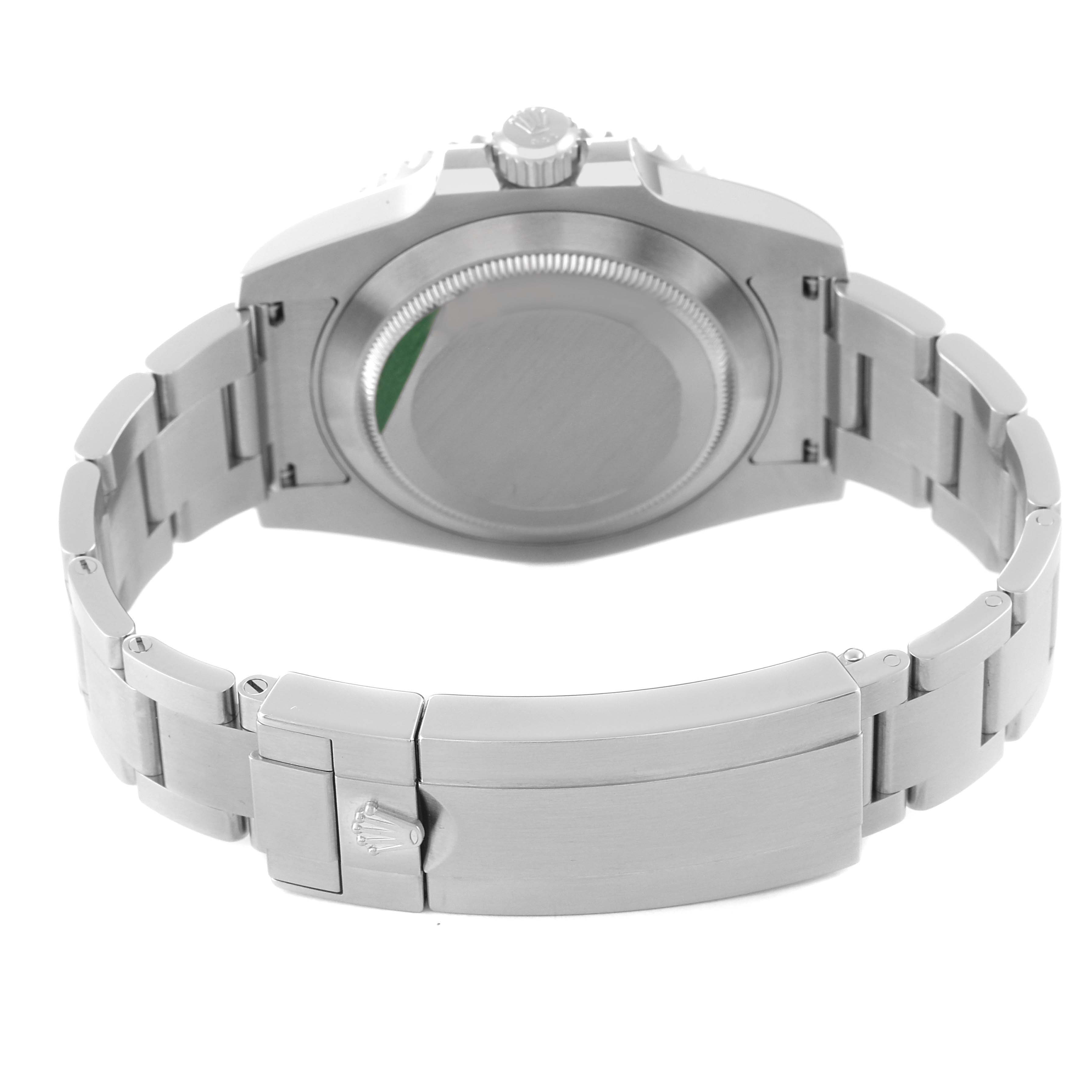 This image shows the back side of a Rolex Submariner 116610LV Men
s Stainless Steel Green Dial 116610LV Men
s Stainless Steel Green Dial watch, highlighting its case back, crown, and clasp in a partially opened position.