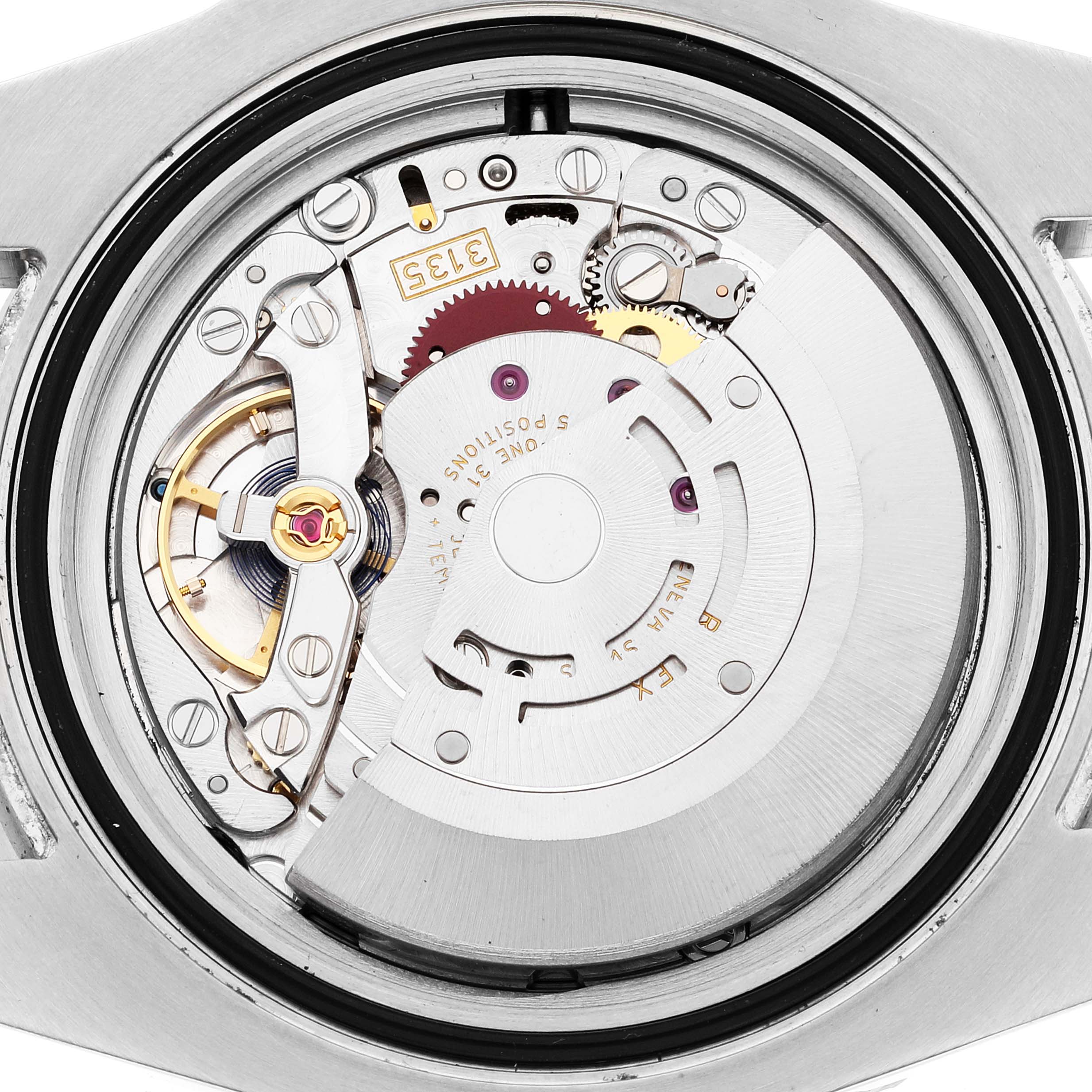 This is an image of the Rolex Submariner 116610LV Men
s Stainless Steel Green Dial 116610LV Men
s Stainless Steel Green Dial
s movement viewed from the back, showing the intricate internal components.