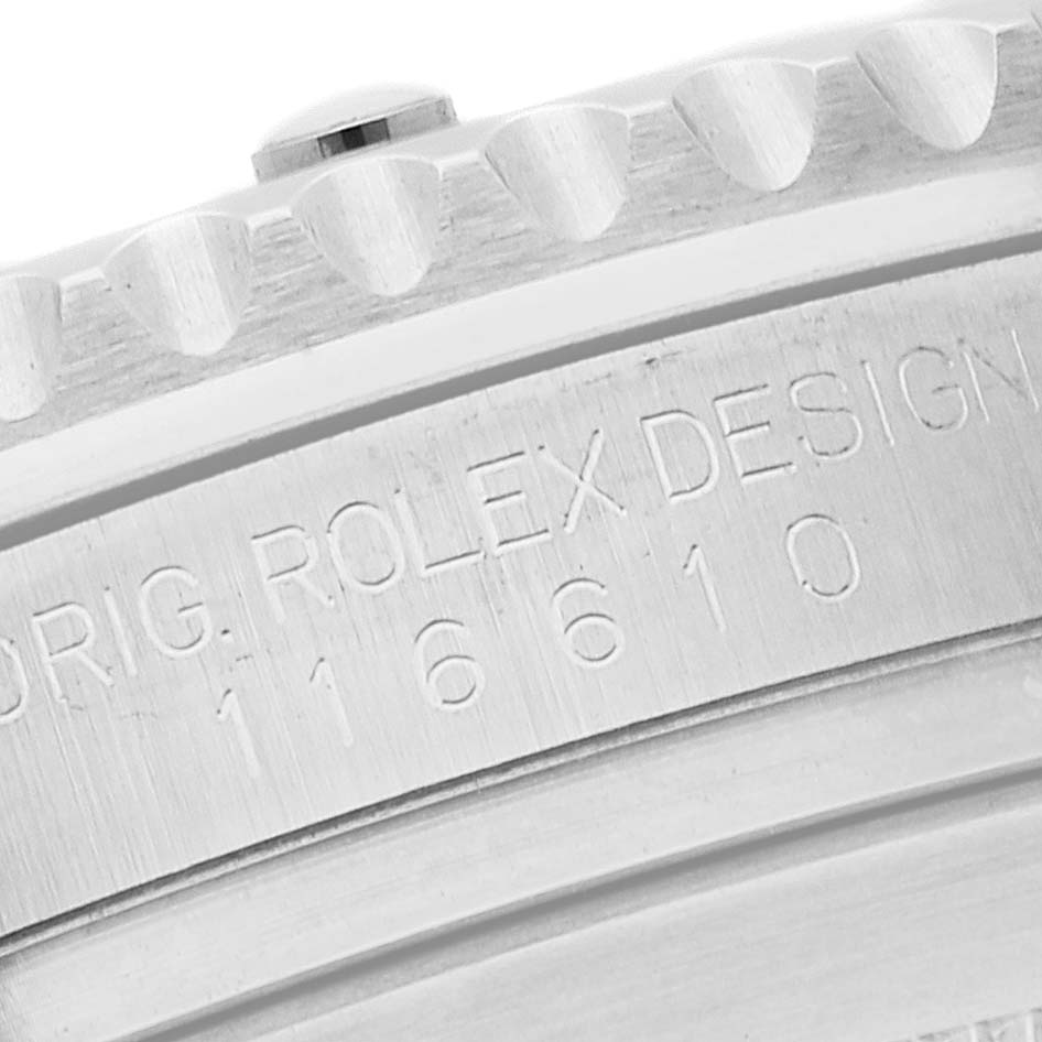 This image shows a close-up of the engraved bezel and case side of a Rolex Submariner 116610LV Men
s Stainless Steel Green Dial 116610LV Men
s Stainless Steel Green Dial with model number 116610.