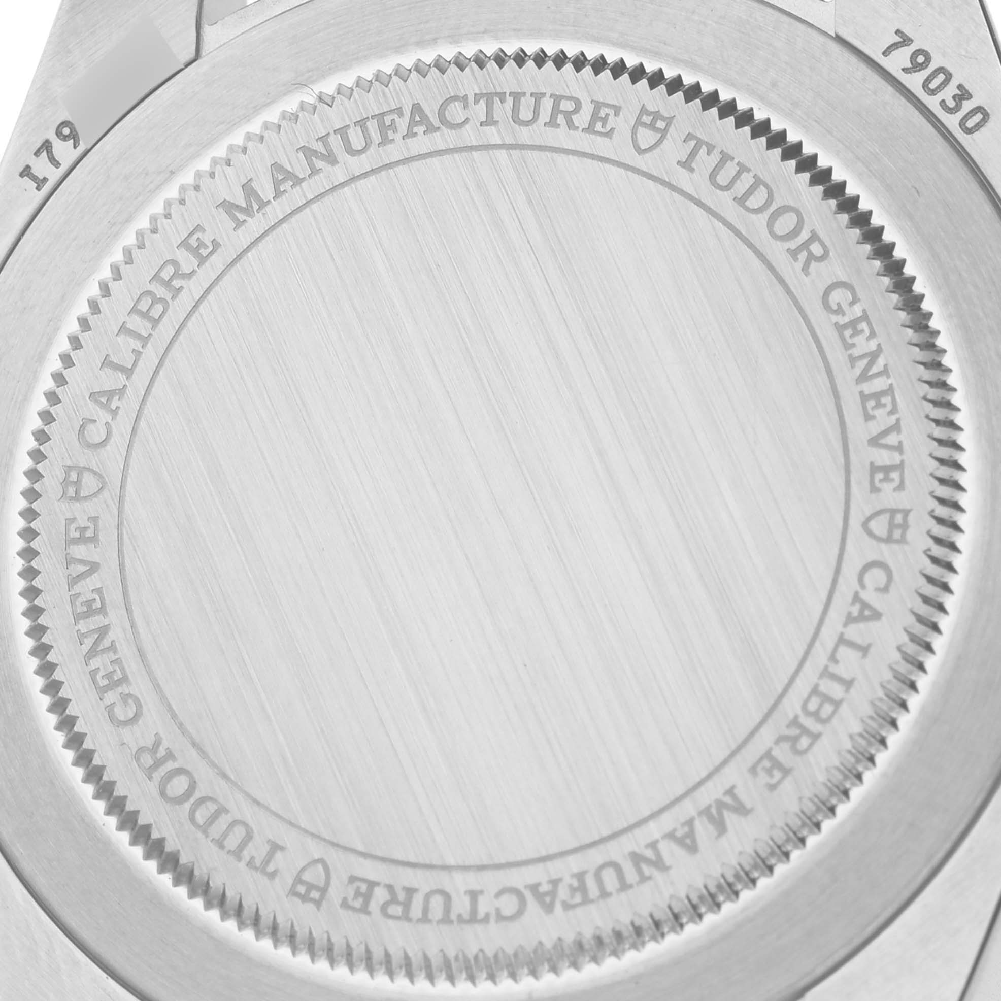 The image shows the case back of the Tudor Heritage Black Bay 79030N-0002 Men's Stainless Steel Black Dial 79030N-0002 Men's Stainless Steel Black Dial watch, highlighting engravings and texture.