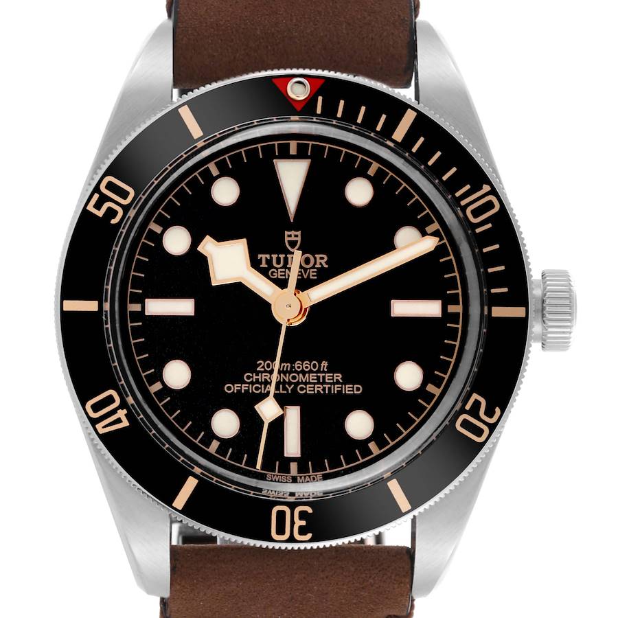 The Tudor Heritage Black Bay watch is shown from the front, displaying the dial, bezel, crown, and part of the strap.