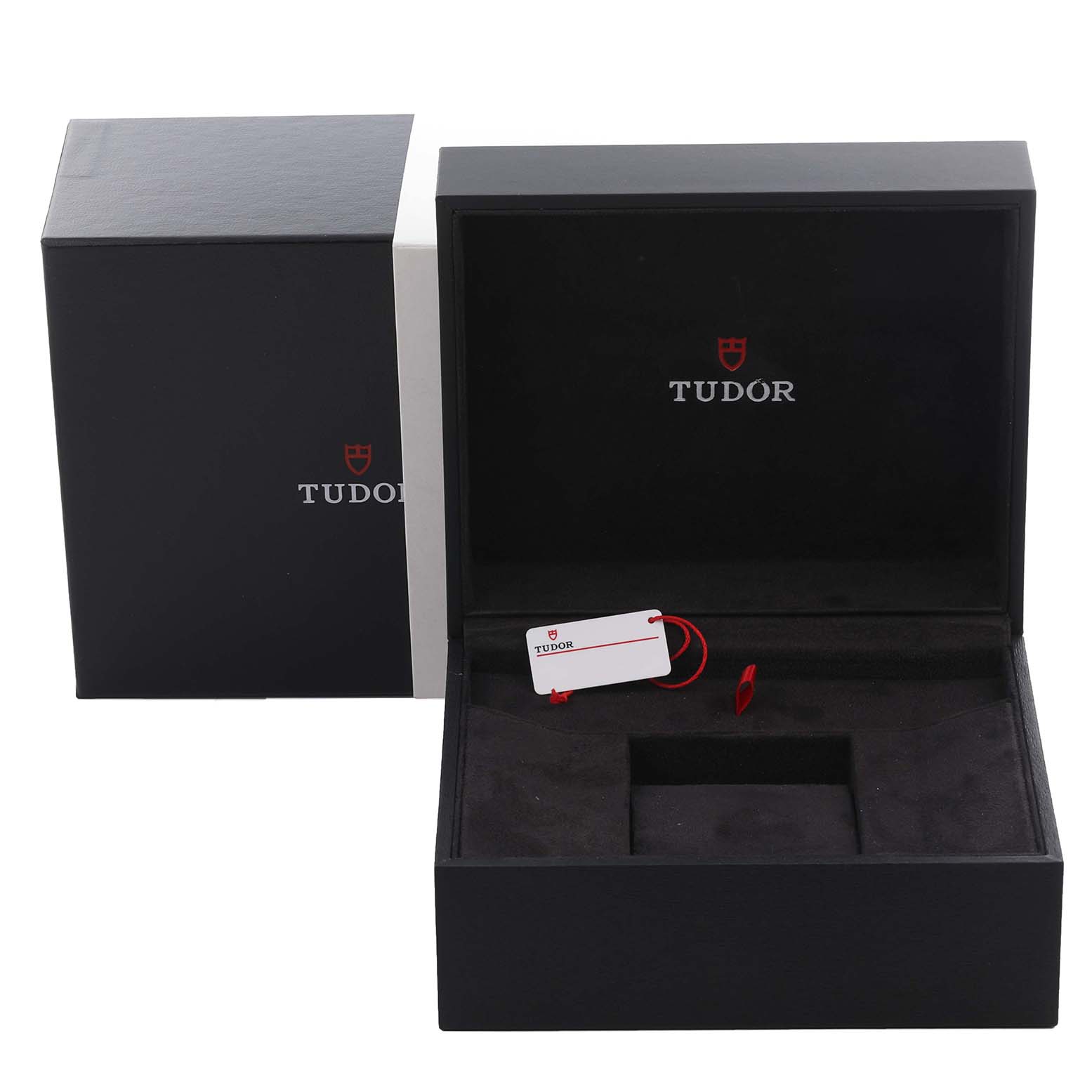 The image shows an open Tudor Heritage Black Bay 79030N-0002 Men's Stainless Steel Black Dial 79030N-0002 Men's Stainless Steel Black Dial watch box with a tag inside, viewed from the front.