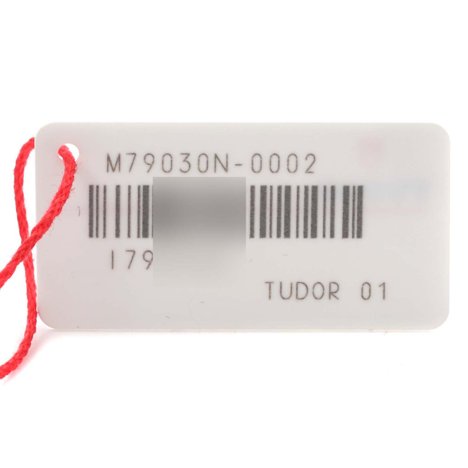 The image shows a tag for a Tudor Heritage Black Bay 79030N-0002 Men's Stainless Steel Black Dial 79030N-0002 Men's Stainless Steel Black Dial watch model, displaying the model number and barcode, with a red string attached.