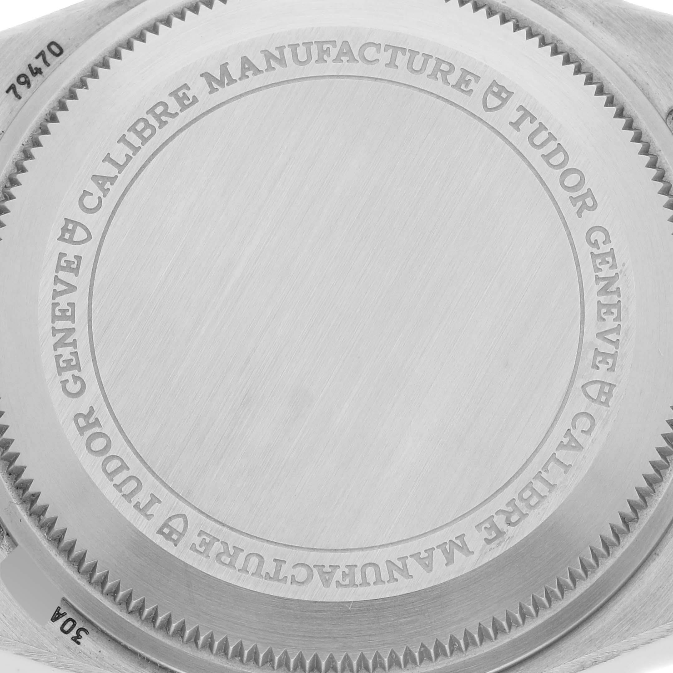 The image shows the back casing of a Tudor Heritage Black Bay M79470-0001 Men
s Stainless Steel Black Dial M79470-0001 Men
s Stainless Steel Black Dial watch, displaying the engraved brand and model details.