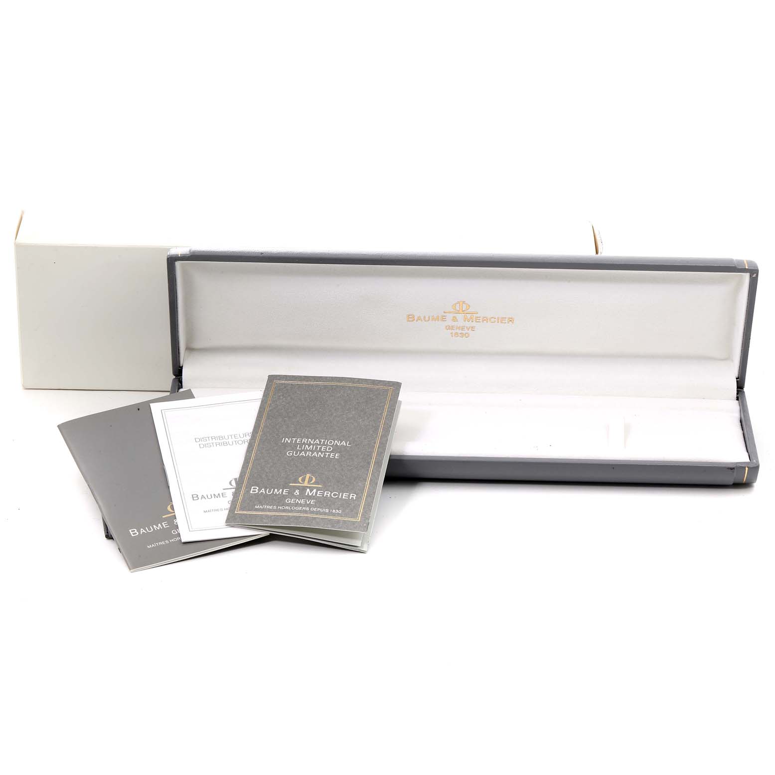The image shows the box and documentation for the Baume & Mercier  Women's Yellow Gold White Dial  Women's Yellow Gold White Dial 14k Yellow Gold White Dial Cocktail Ladies Watch model.