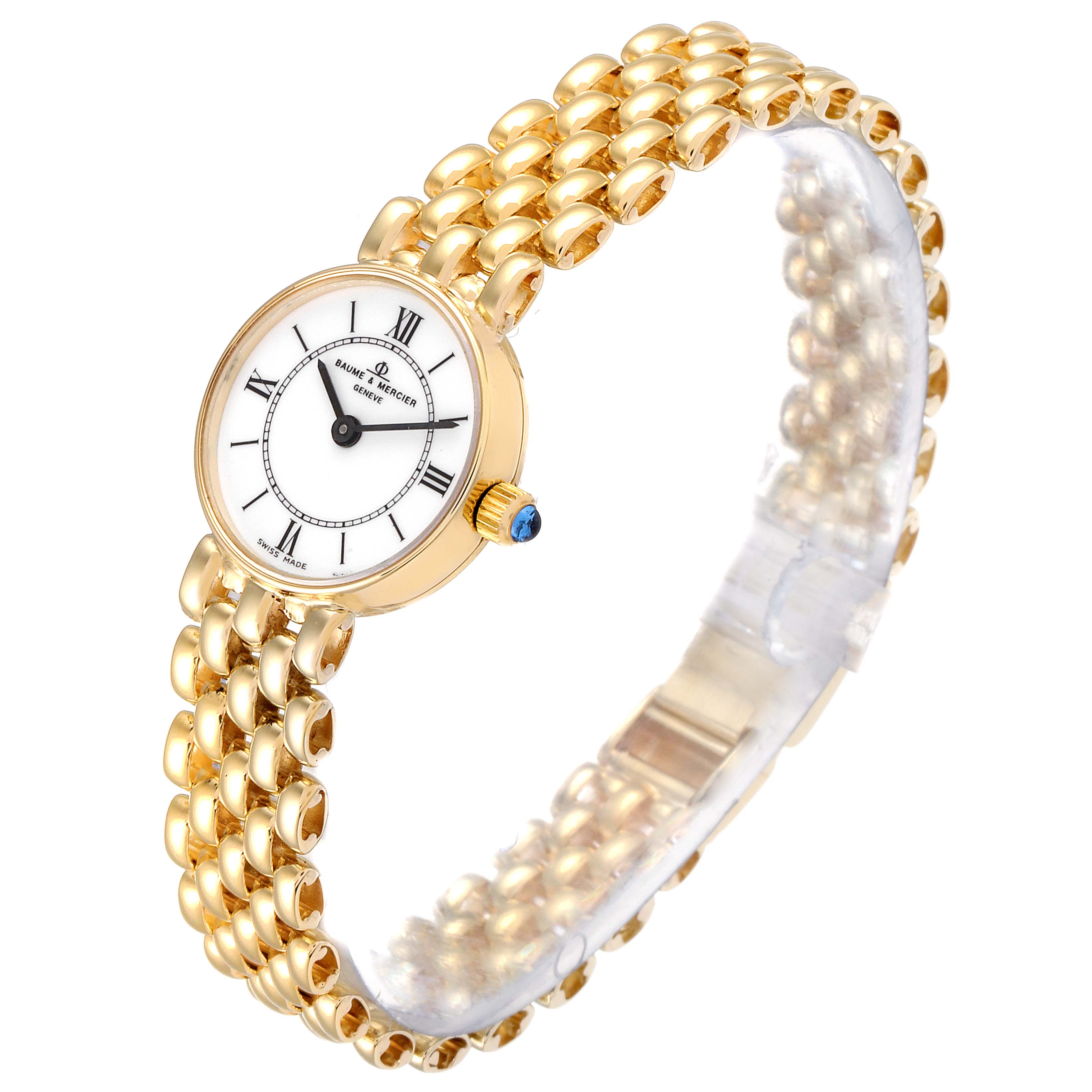 The image showcases a Baume & Mercier  Women's Yellow Gold White Dial  Women's Yellow Gold White Dial 14k Yellow Gold White Dial Cocktail Ladies Watch from a diagonal side view.