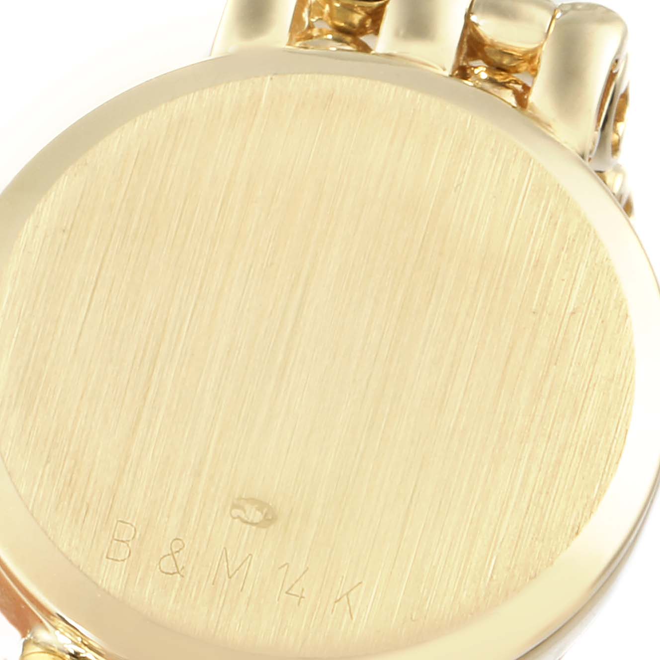 This image shows the back of the case of a Baume & Mercier  Women's Yellow Gold White Dial  Women's Yellow Gold White Dial 14k Yellow Gold White Dial Cocktail Ladies Watch.