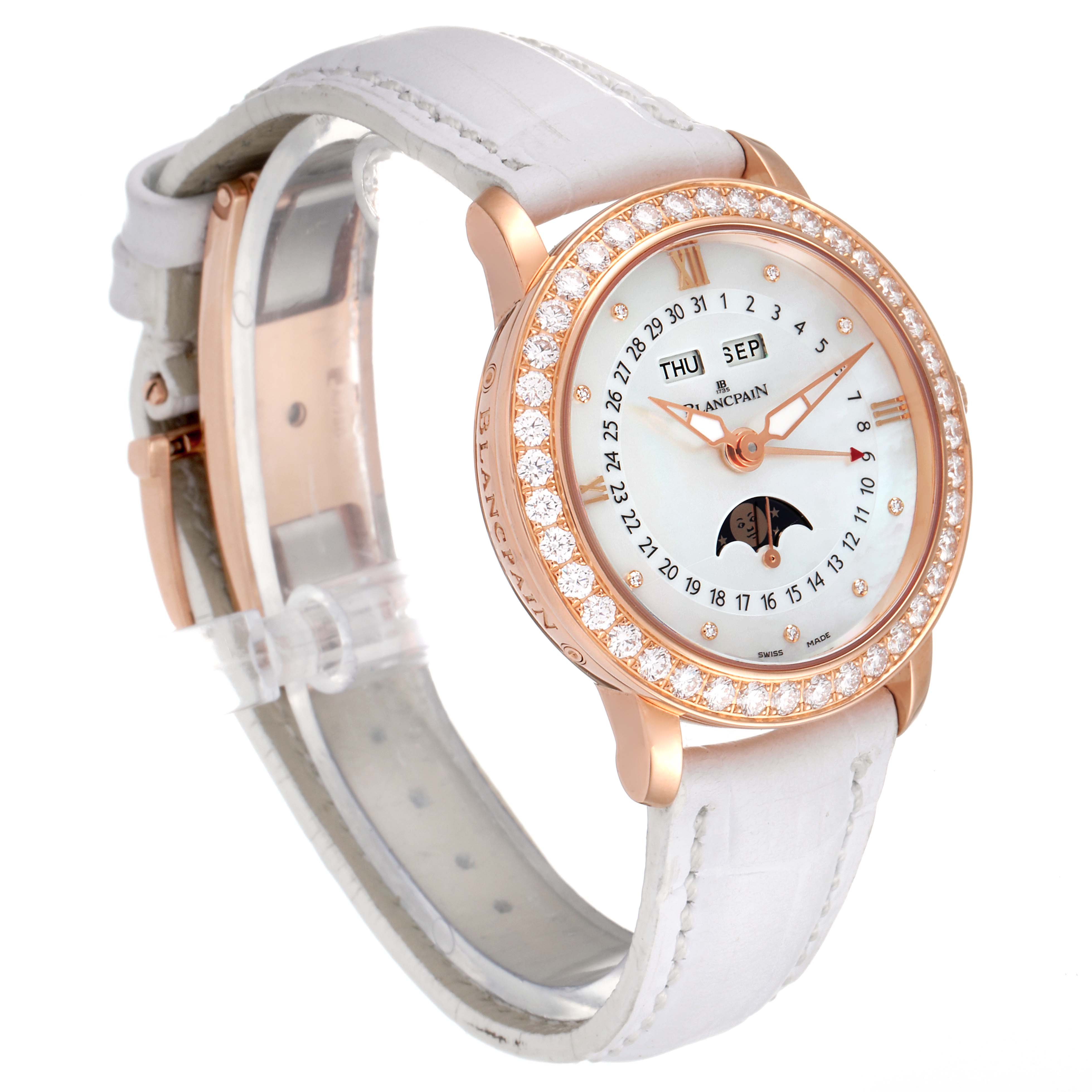 The Blancpain 3663-2954-55B Women's Rose Gold Mother of Pearl Dial 3663-2954-55B Women's Rose Gold Mother of Pearl Dial Quantieme Complet 18k Rose Gold Diamond Watch 3663-2954-55B is shown at a slight angle, highlighting its face, strap, and bezel.