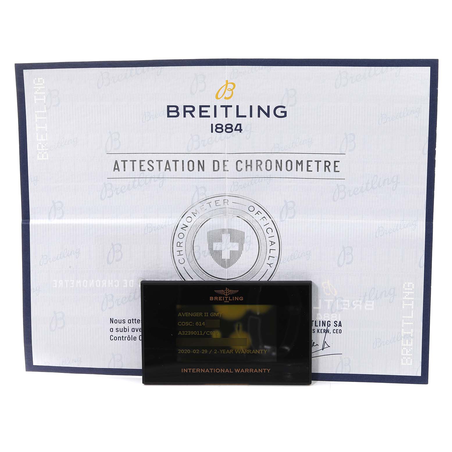 This image shows the warranty card and chronometer certificate for the Breitling Avenger A32390 Men's Stainless Steel Mother of Pearl Dial A32390 Men's Stainless Steel Mother of Pearl Dial II.