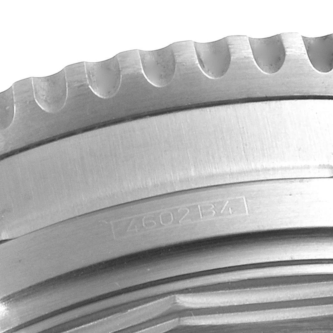 The image shows a close-up of the bezel and case edge of a Breitling Navitimer A41322 Men
s Stainless Steel Black Dial A41322 Men
s Stainless Steel Black Dial watch.