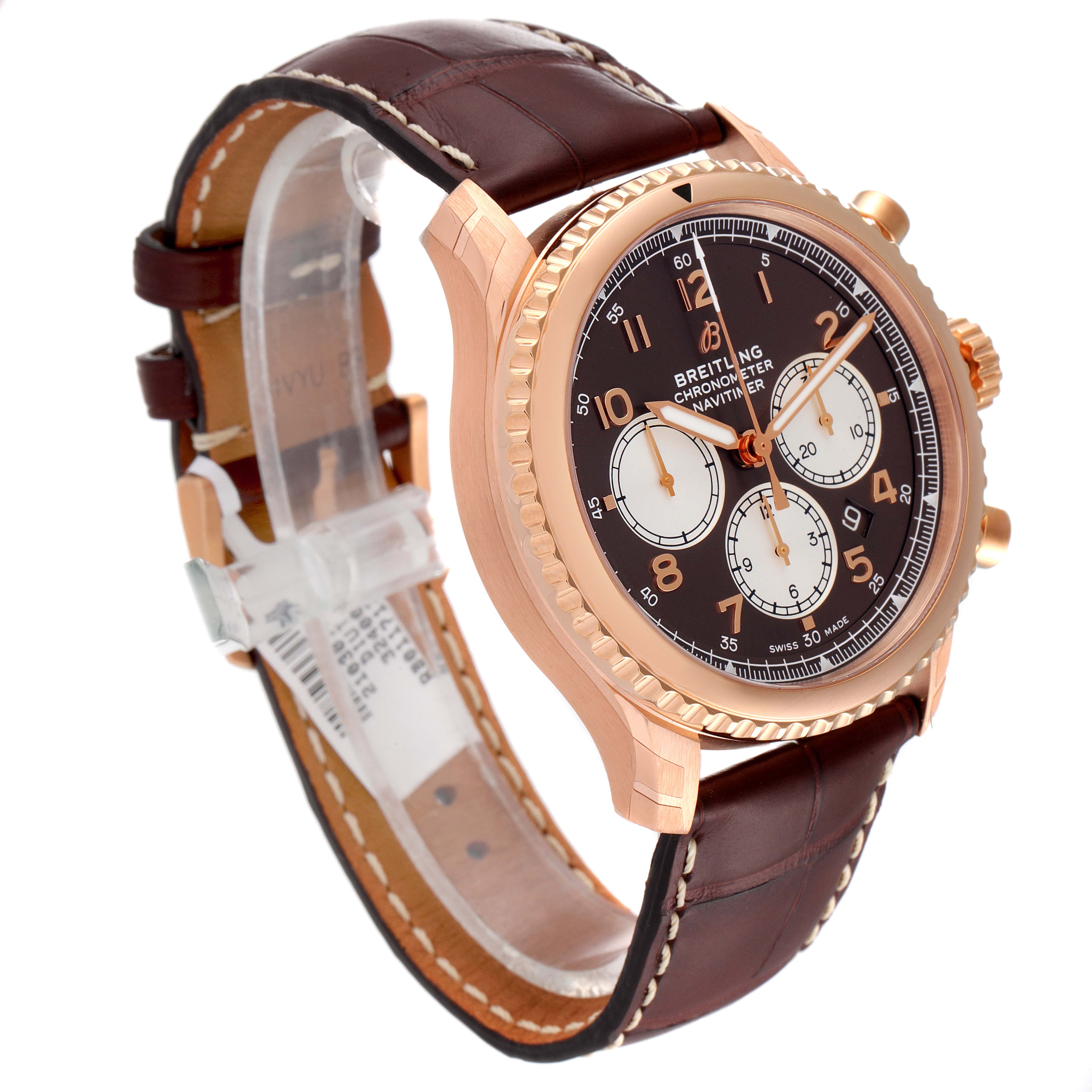 The Breitling Navitimer watch is shown at a slight angle, highlighting the brown leather strap, gold case, and detailed dial.