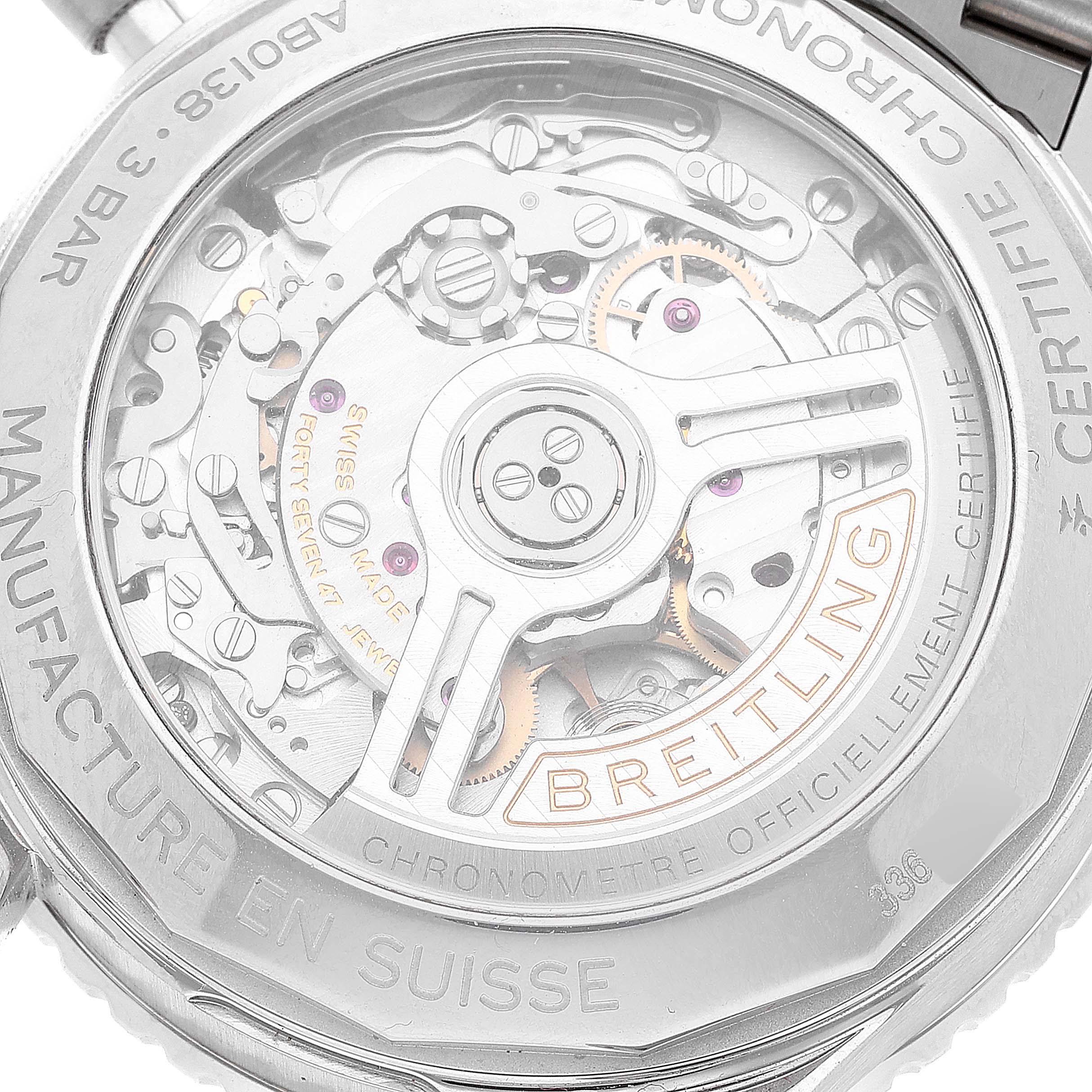 The image shows the back view of a Breitling Navitimer AB0138 Men's Stainless Steel Silver Dial AB0138 Men's Stainless Steel Silver Dial watch, highlighting its intricate movement and the transparent case back.