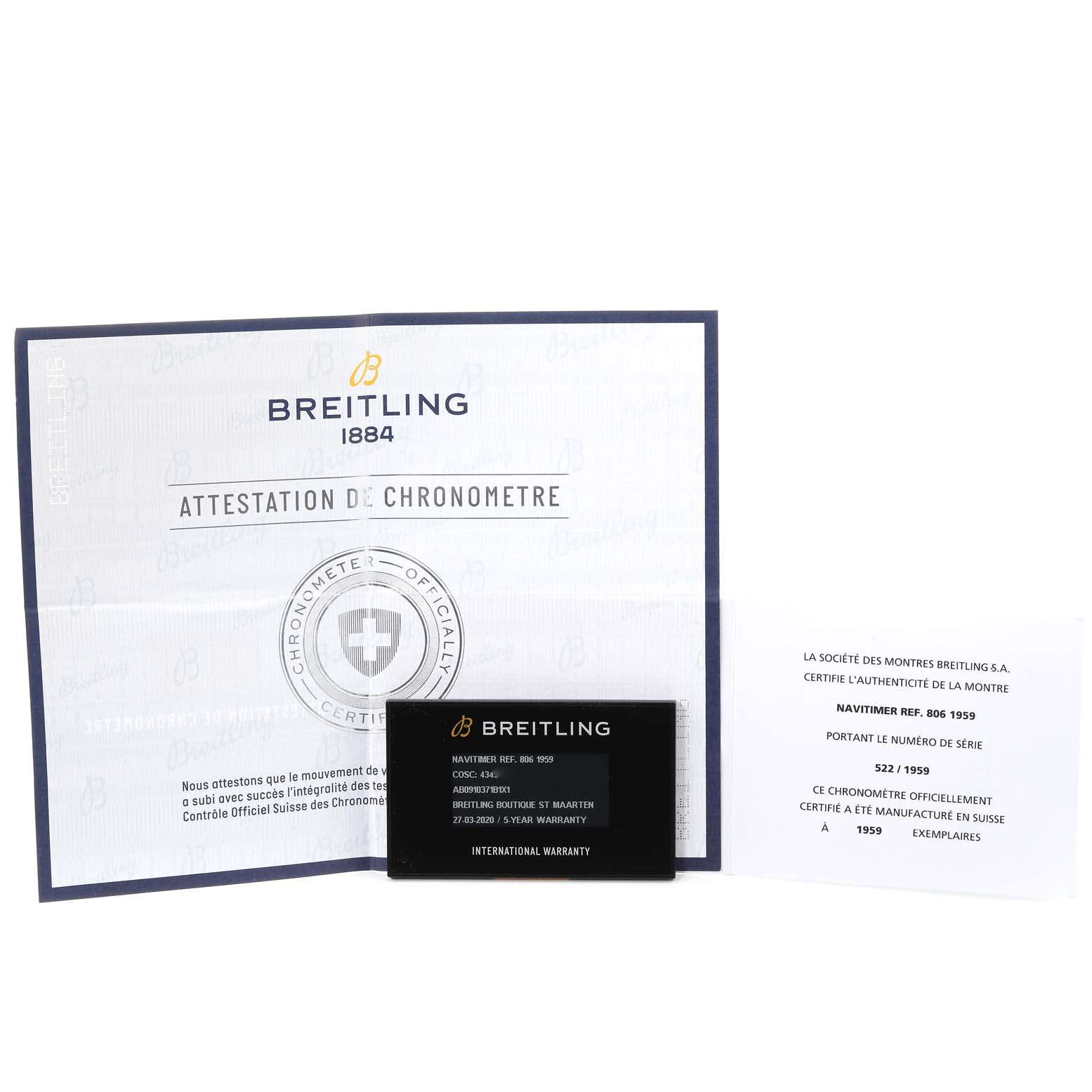 The image shows documentation and a warranty card for the Breitling Navitimer AB0910371B1X1 Men's Stainless Steel Black Dial AB0910371B1X1 Men's Stainless Steel Black Dial watch model, displayed from a front angle.