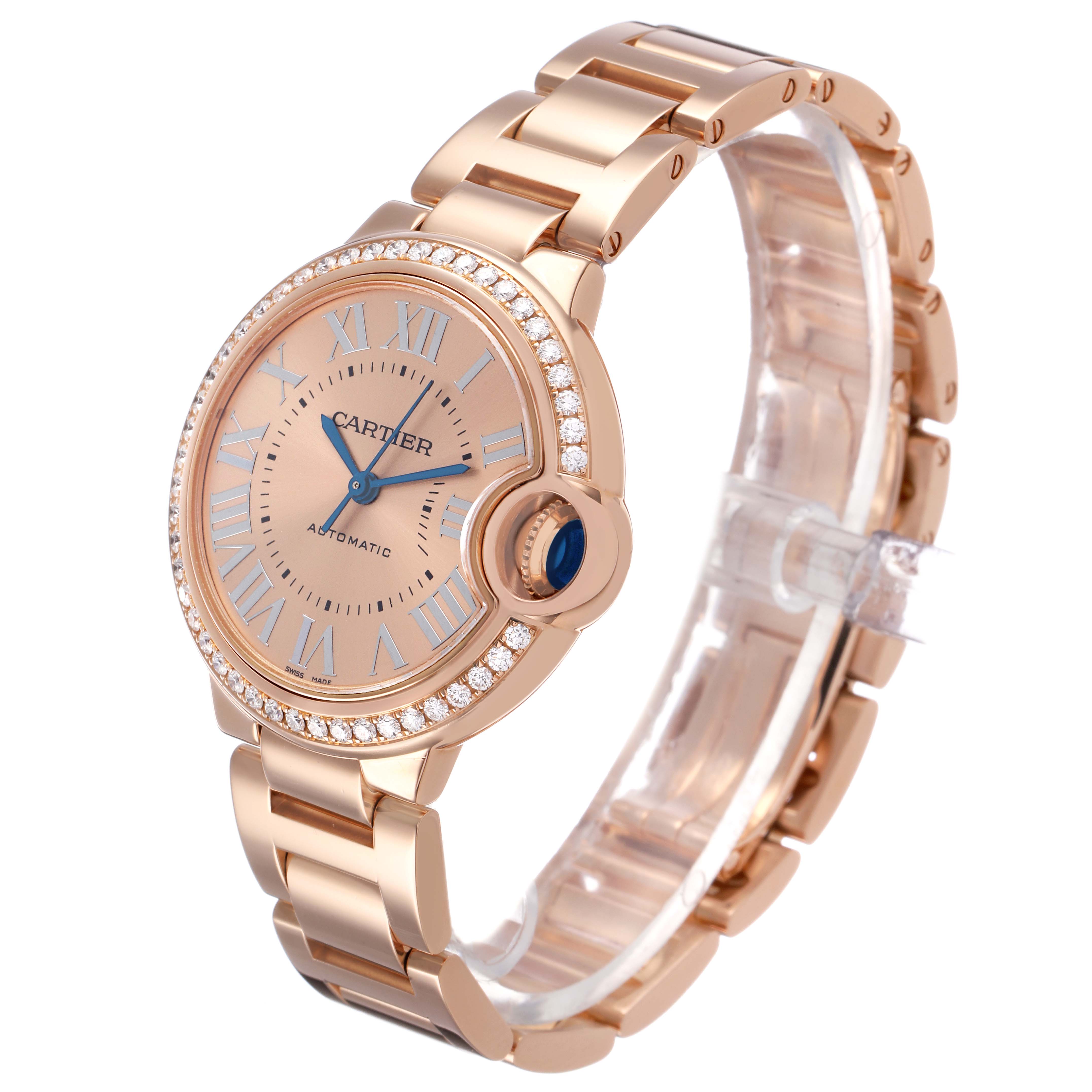 The Cartier Ballon Bleu WJBB0077 Women's Rose Gold Pink Dial watch is shown at a slight angle, displaying the dial, crown, and bracelet.