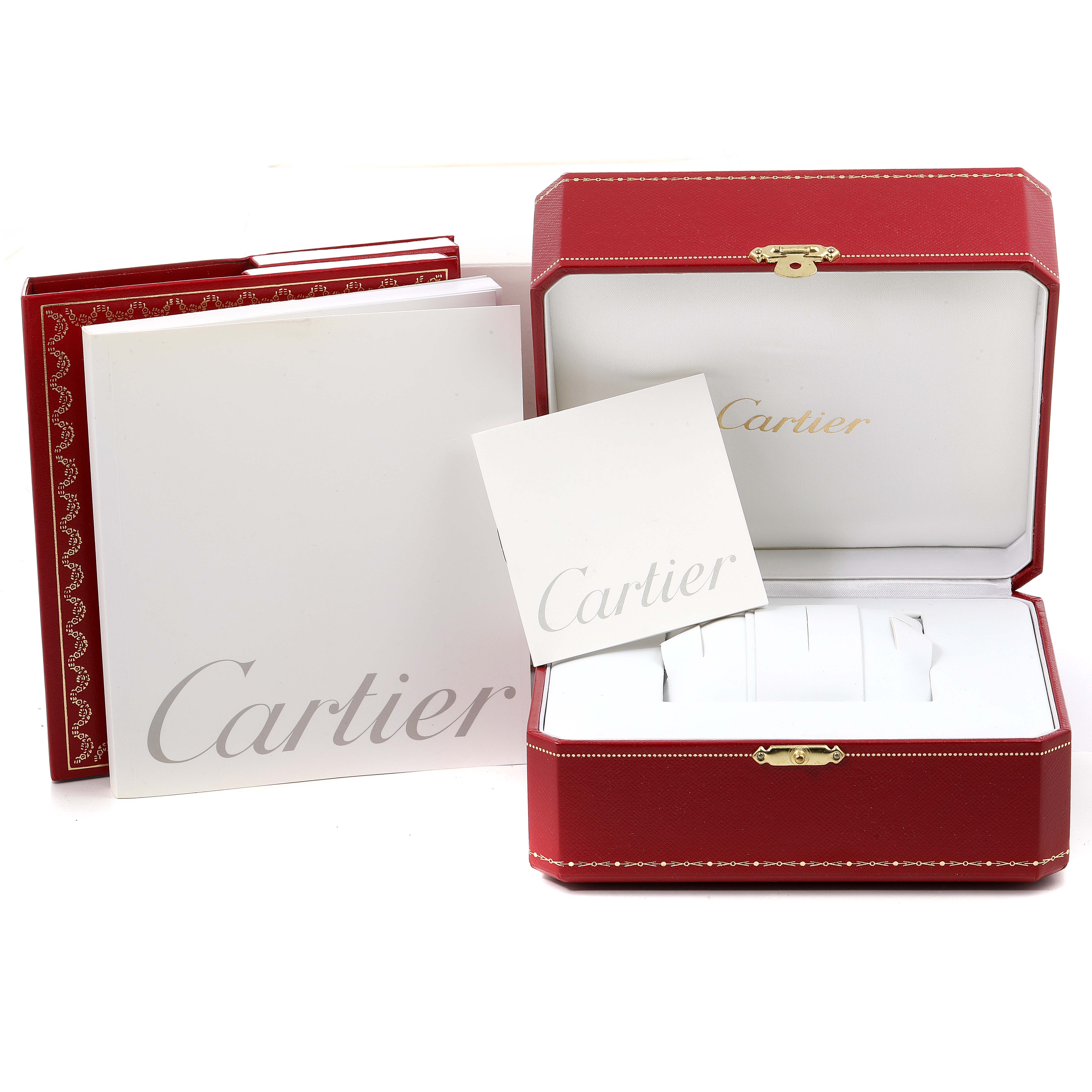 This image shows the packaging contents of a Cartier Pasha W31080M7 Men
s Stainless Steel Silver Dial W31080M7 Men
s Stainless Steel Silver Dial watch, including the opened red box and accompanying booklets.