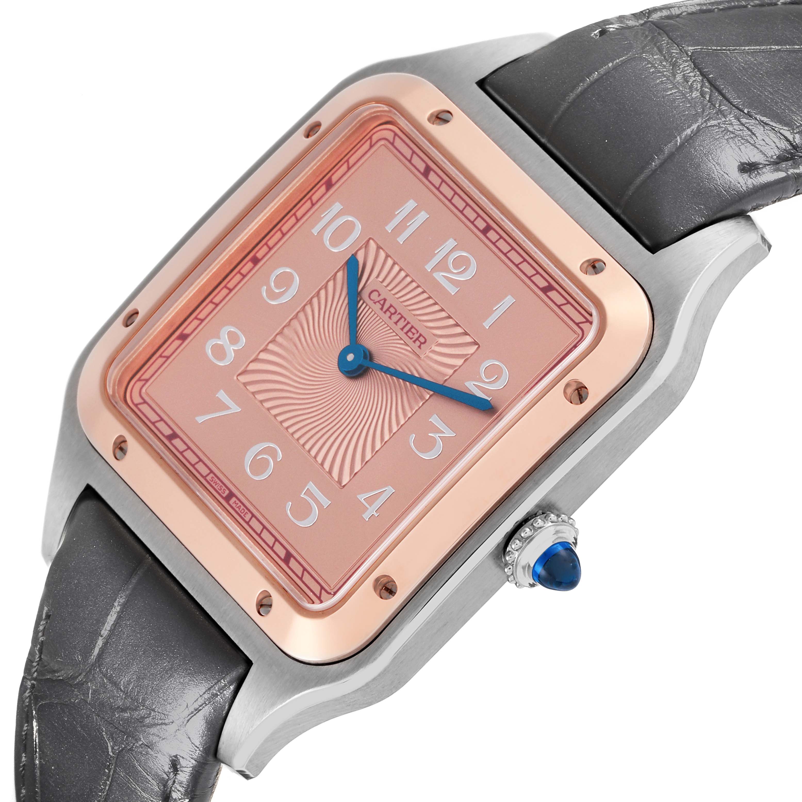 The Cartier Santos Dumont W2SA0025 Men
s Steel and Gold (two tone) Pink Dial W2SA0025 Men
s Steel and Gold (two tone) Pink Dial watch is shown at an angle highlighting the dial, bezel, case, crown, and part of the strap.