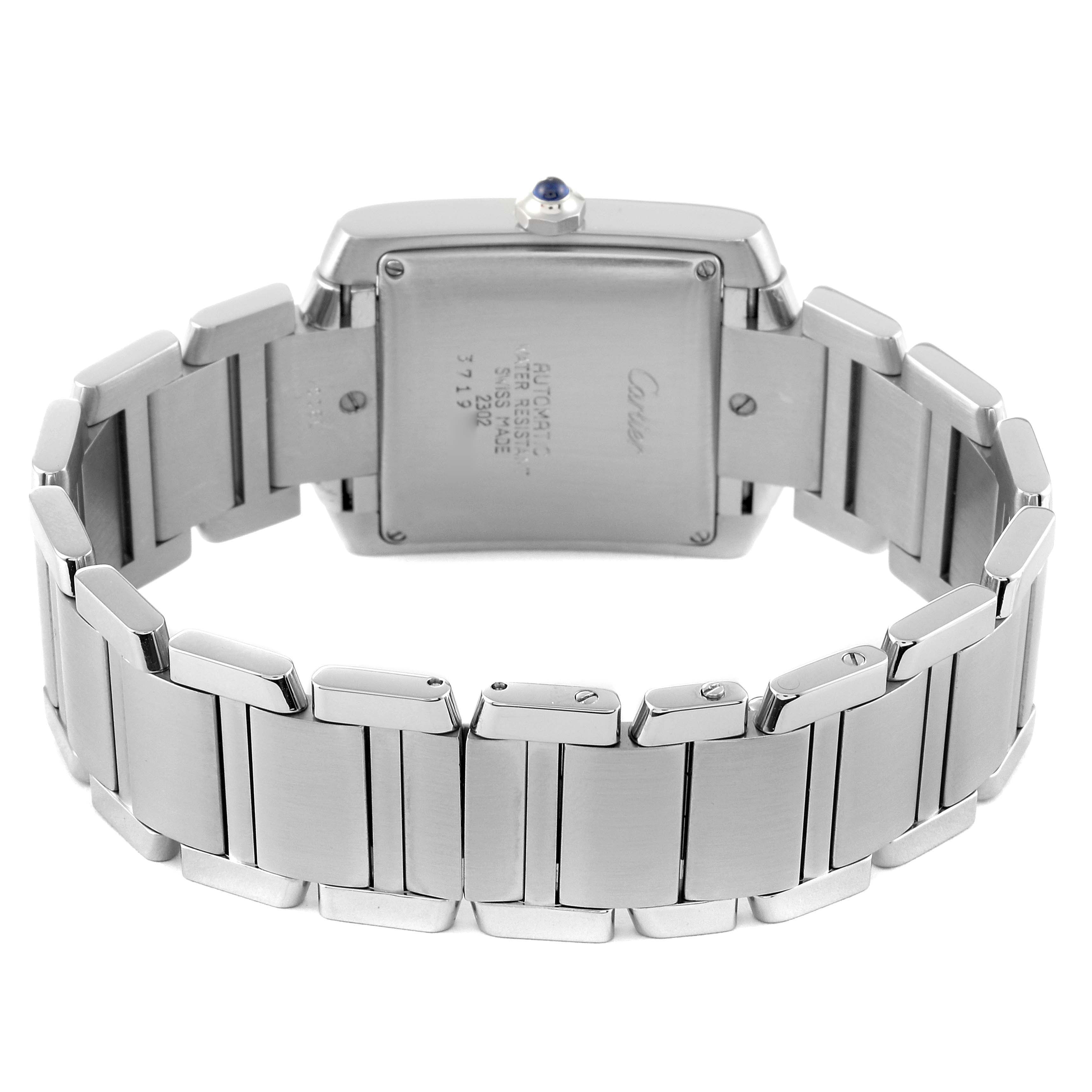 The image shows the back view of a Tank Française model by Cartier, highlighting its stainless steel bracelet and case back.