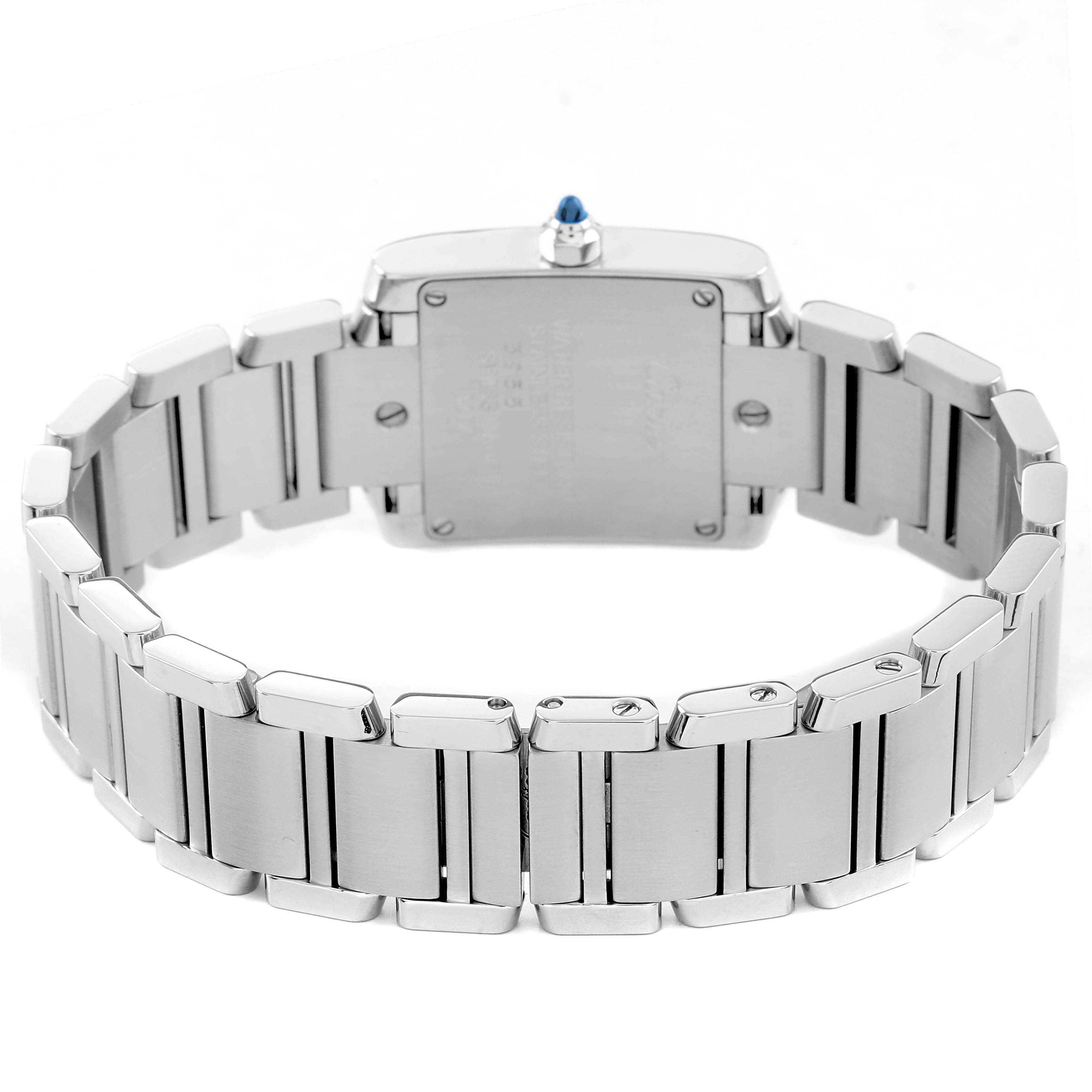 The Cartier Tank Française watch is shown from the back, highlighting the case back, bracelet, and crown with a blue stone.