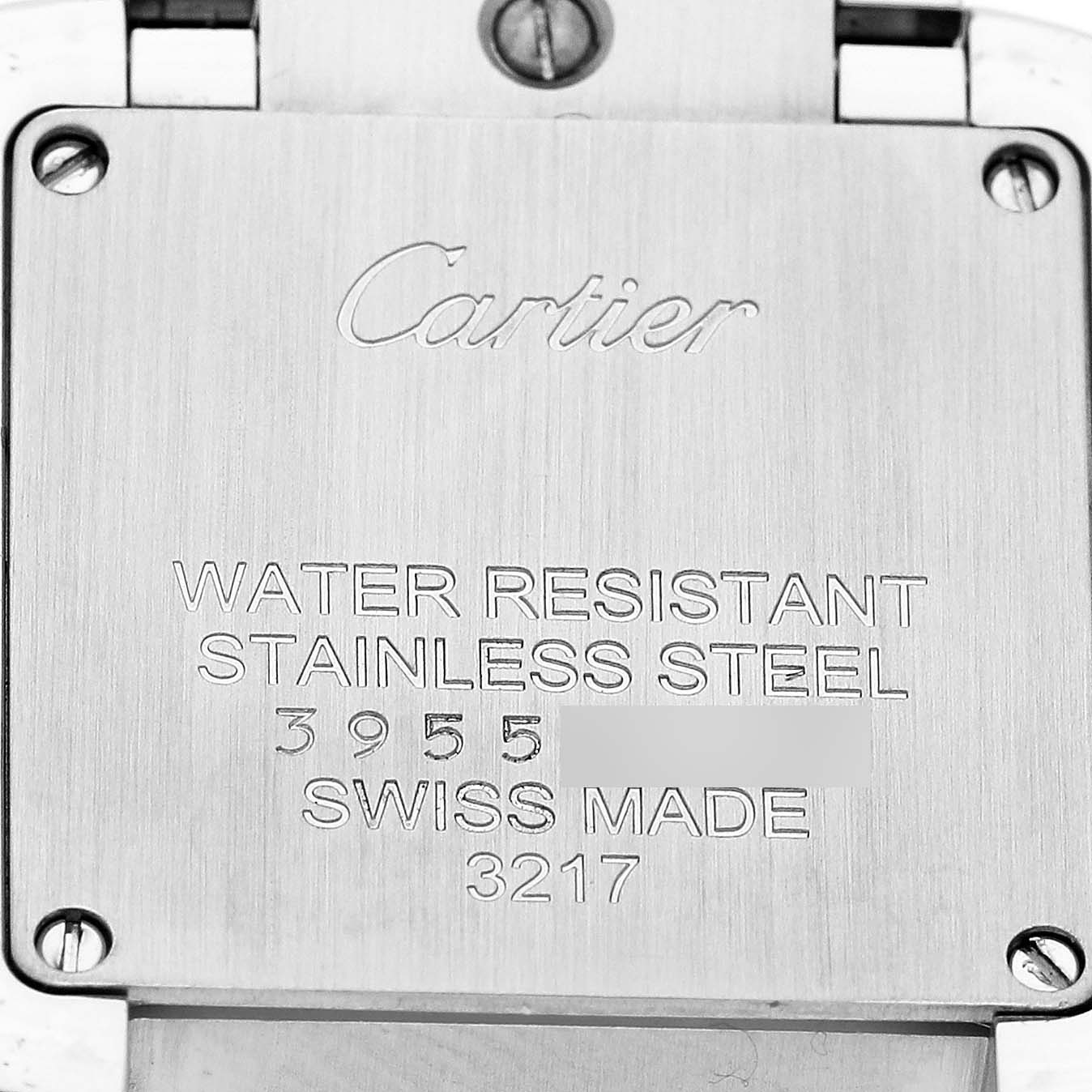 This image shows the back case of a Cartier Tank Française watch, highlighting the brand, water resistance, and stainless steel details.