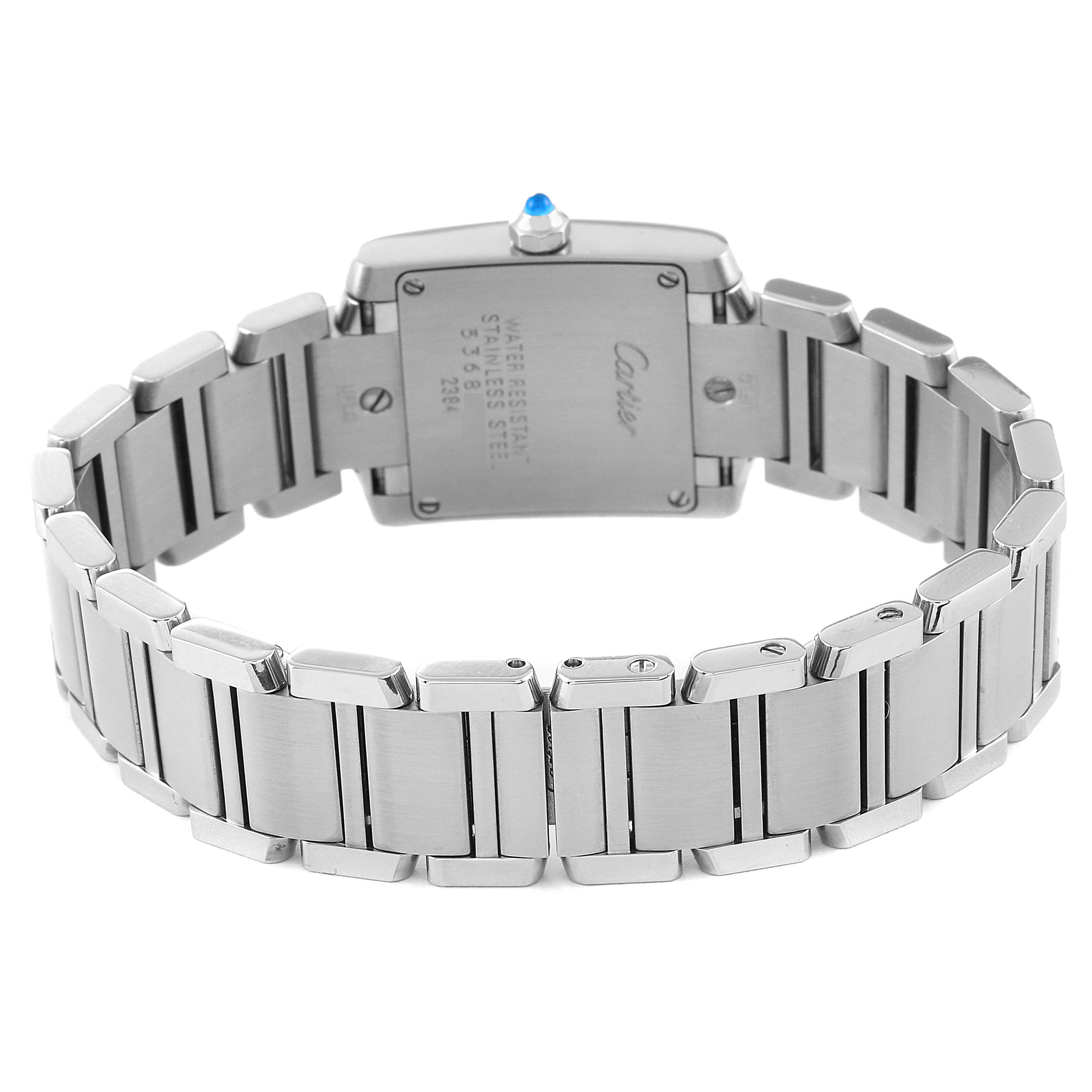 The image shows the back view of a Cartier Tank Française watch, highlighting the stainless steel bracelet and case back.