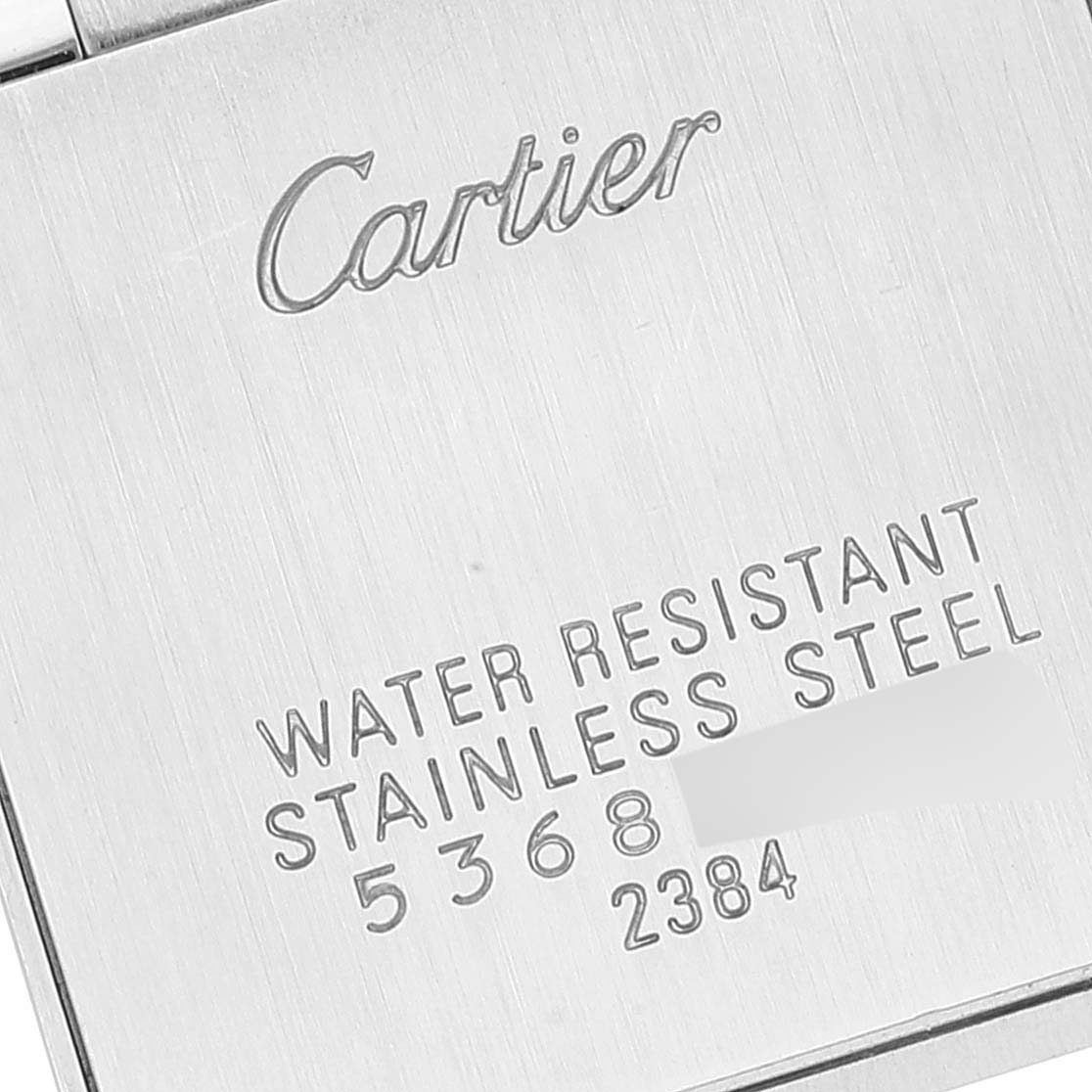 This image shows the case back of a Cartier Tank Française watch, highlighting the engraved brand name and specifications.