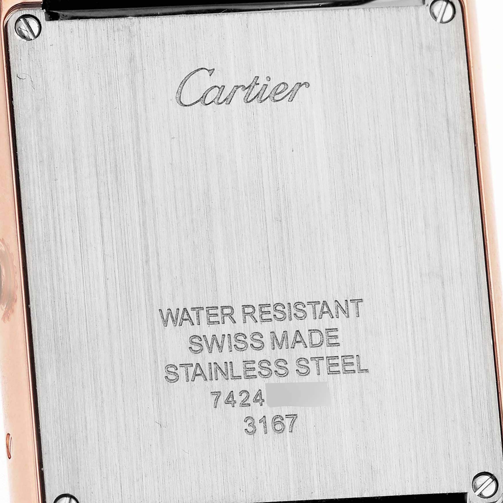 The image shows the back of a Cartier Tank Solo W5200025 Men's Yellow Gold Silver Dial W5200025 Men's Yellow Gold Silver Dial watch, detailing "water resistant" and "Swiss made" engravings.