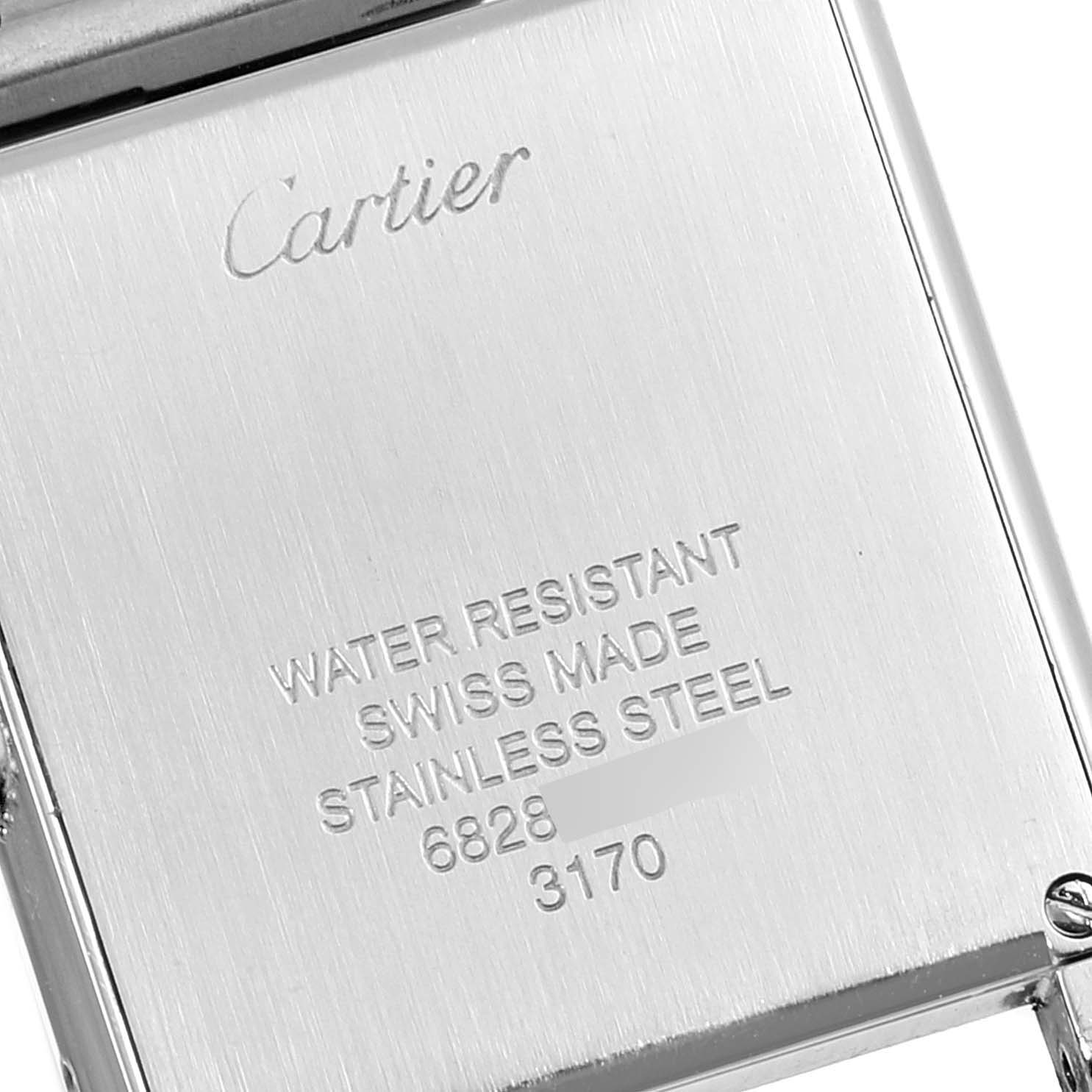 This image shows the back casing of a Cartier Tank Solo W5200013 Women's Stainless Steel Silver Dial W5200013 Women's Stainless Steel Silver Dial watch, highlighting its engraving details and materials.
