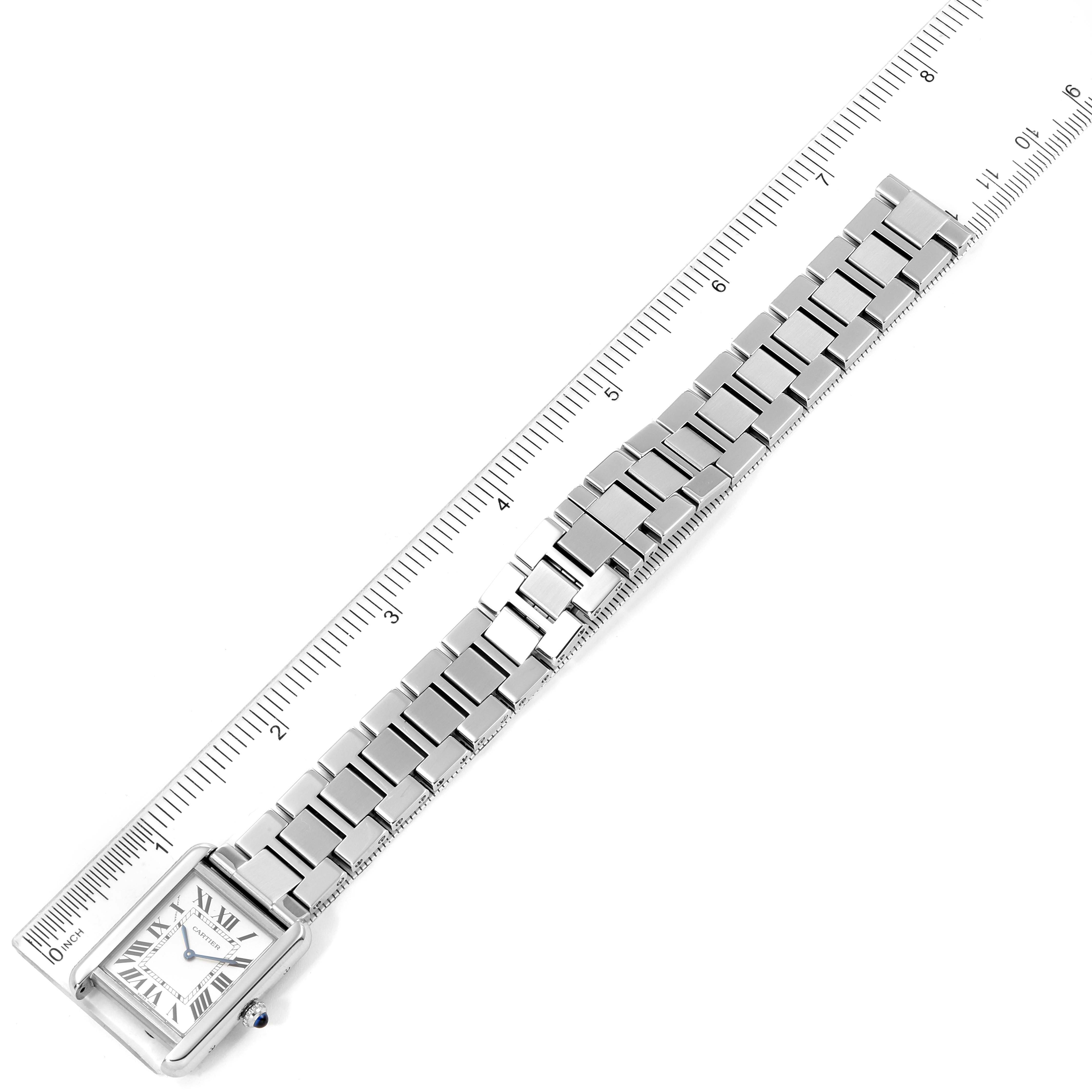 The image shows a Cartier Tank Solo W5200013 Women's Stainless Steel Silver Dial W5200013 Women's Stainless Steel Silver Dial watch laid flat with a ruler beside it, highlighting the bracelet and watch face.