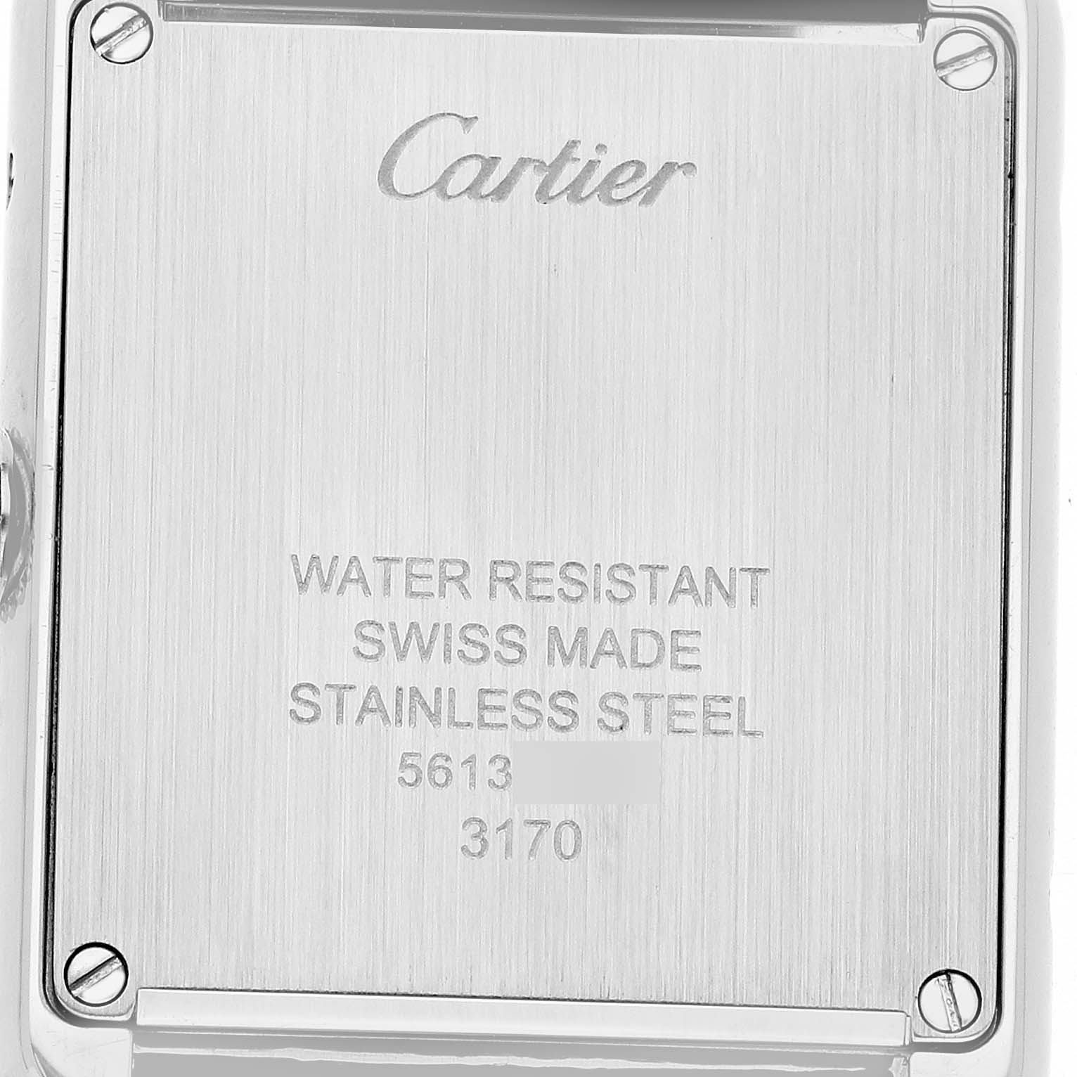 The image shows the back case of the Cartier Tank Solo WSTA0030 Women's Stainless Steel Silver Dial watch, highlighting engravings like "Swiss Made" and "Water Resistant."