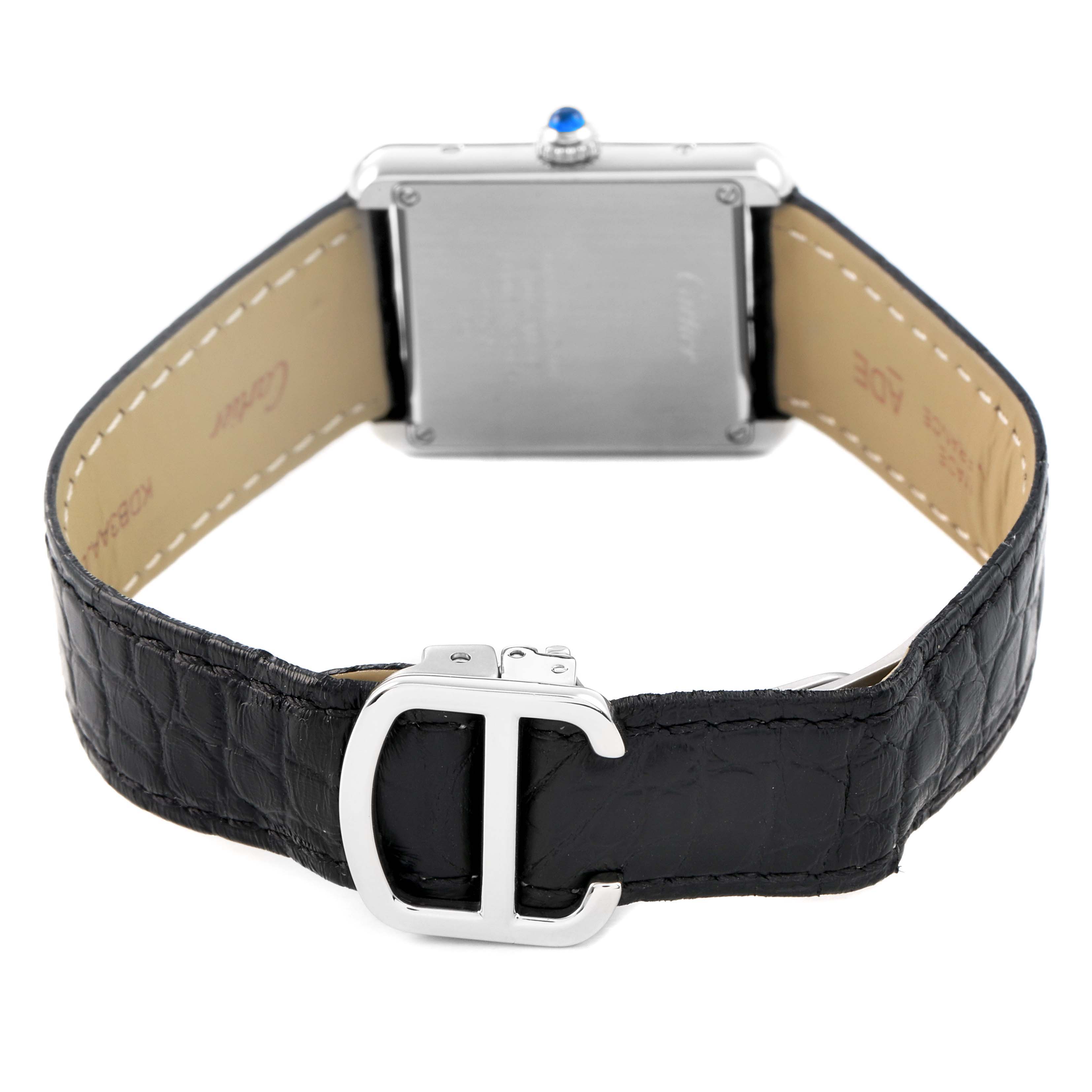 The Cartier Tank Solo WSTA0030 Women's Stainless Steel Silver Dial watch is shown from the back, highlighting the leather strap and clasp.