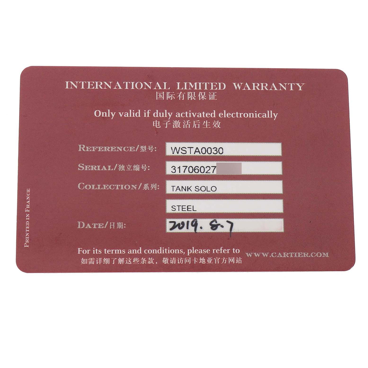 The image shows an International Limited Warranty card for a Cartier Tank Solo WSTA0030 Women's Stainless Steel Silver Dial watch, including reference, serial, and date details.